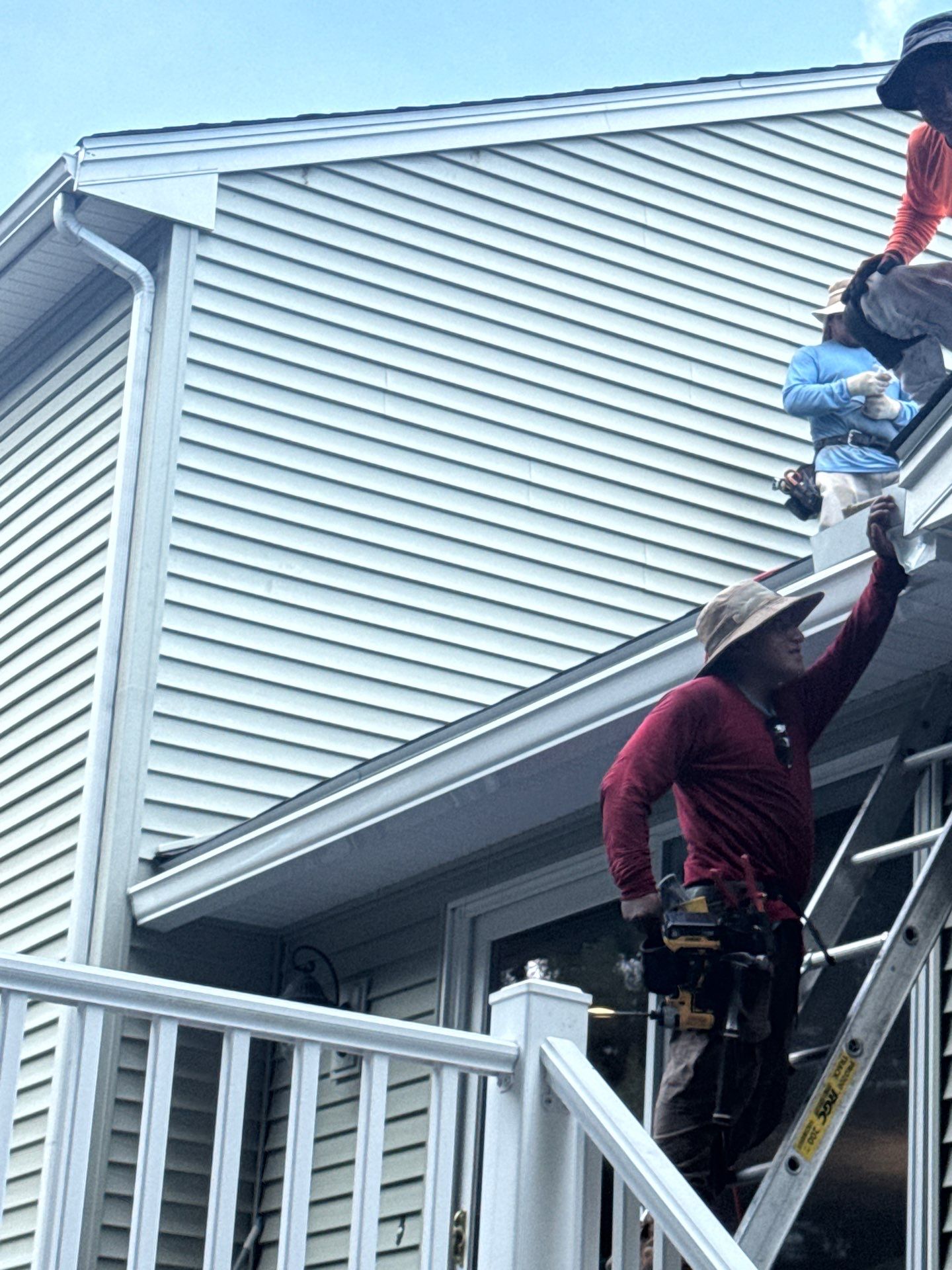 Complete Roof Replacement with Chimney Flashing, Gutter Guard System, and Vinyl Siding Repairs by Mighty Dog Roofing of Greater Middlesex County