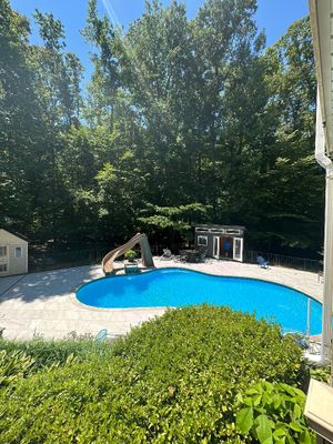 Pool Surround remodel with retaining walls, new waterfall and water slide
