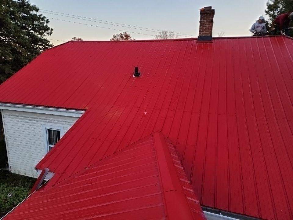 Residential Roof Installation with Red Pro Rib Metal Roofing in Adell, WI by Gellings Roofing and Siding LLC