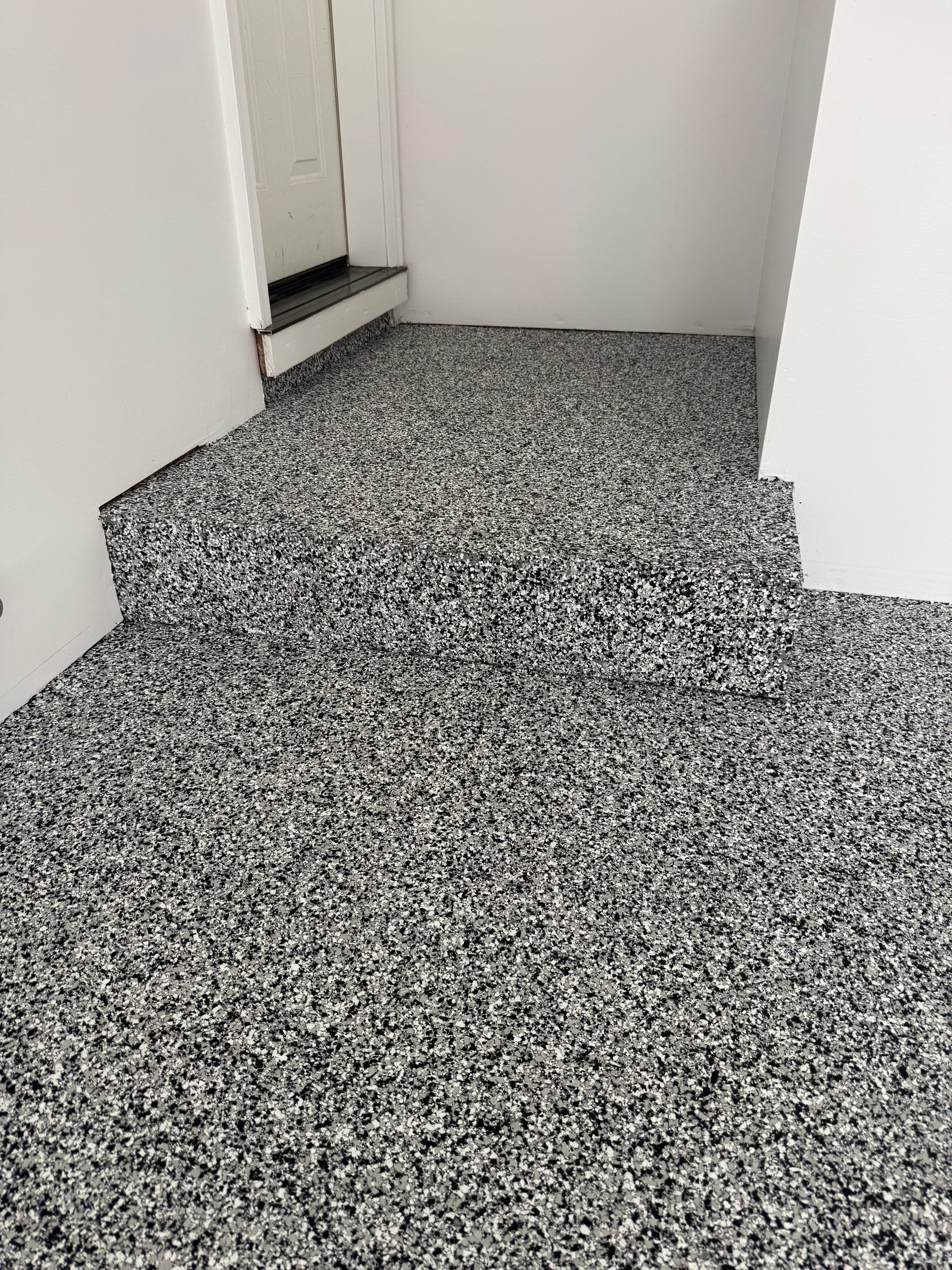 Full Garage Floor and Basement Stair Epoxy Coating in Sioux Falls by Select Painting, Coatings & Garage Cabinets