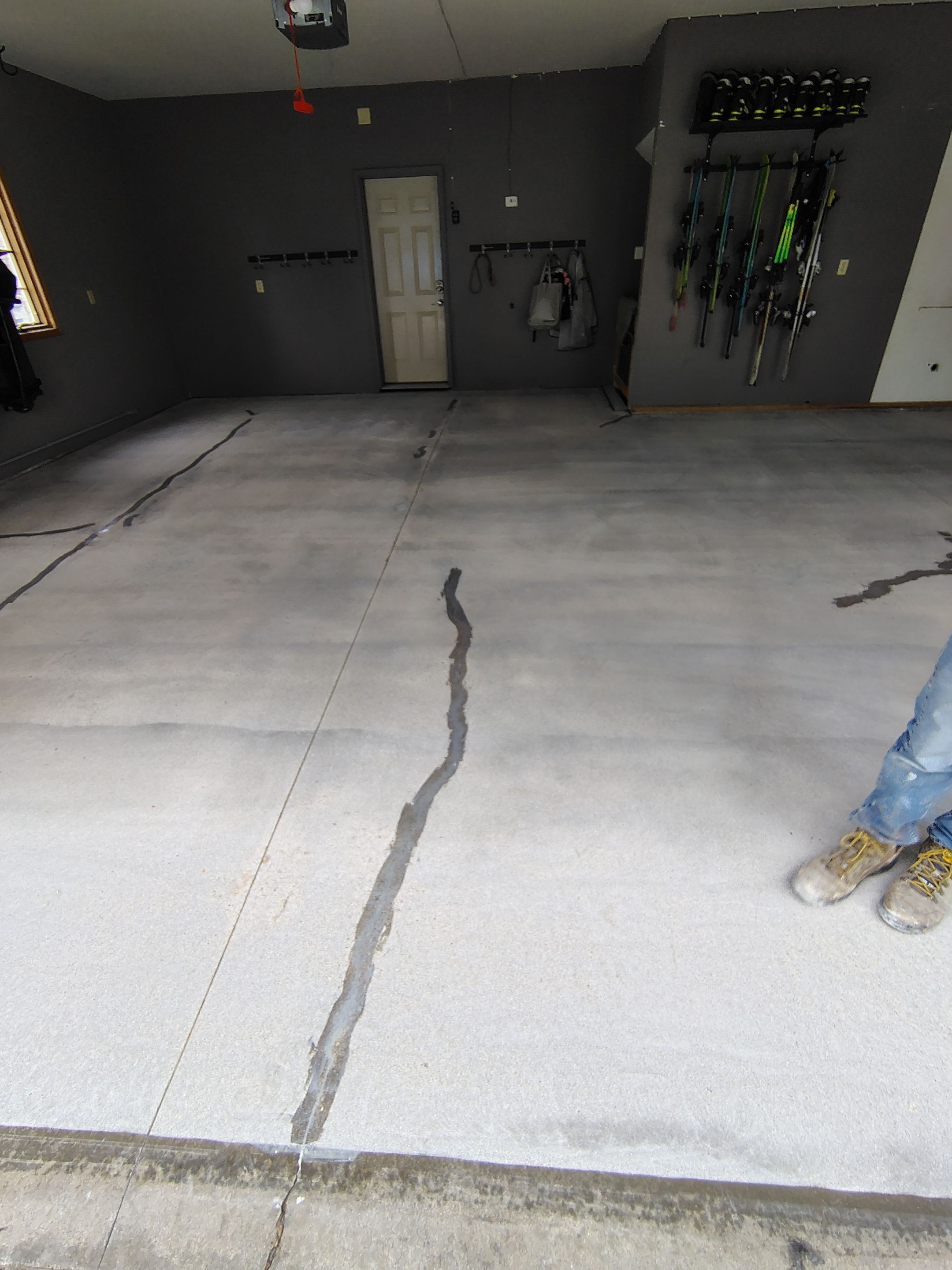 Garage Floor Concrete Coating and Crack Repair in Sioux Falls by Select Painting, Coatings & Garage Cabinets