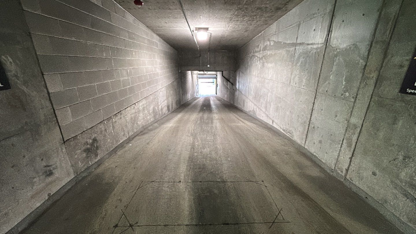 Parking garage using Hot water by Northern Power Washing LLC.