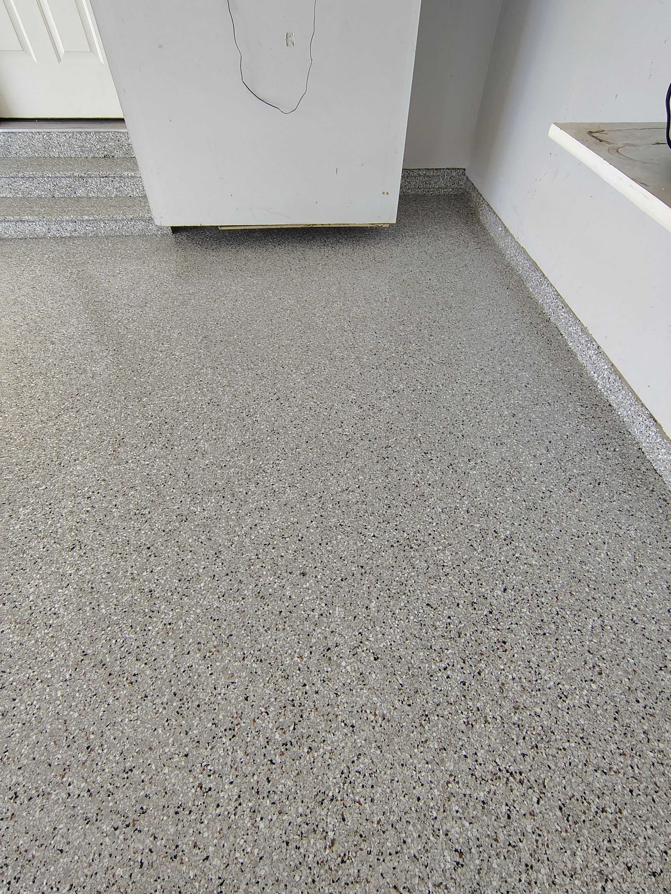 Decorative Chip Epoxy Garage Floor Coating in Sioux Falls by Select Painting, Coatings & Garage Cabinets