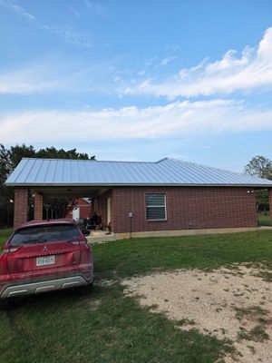 Side view of standing seam metal roof on home.