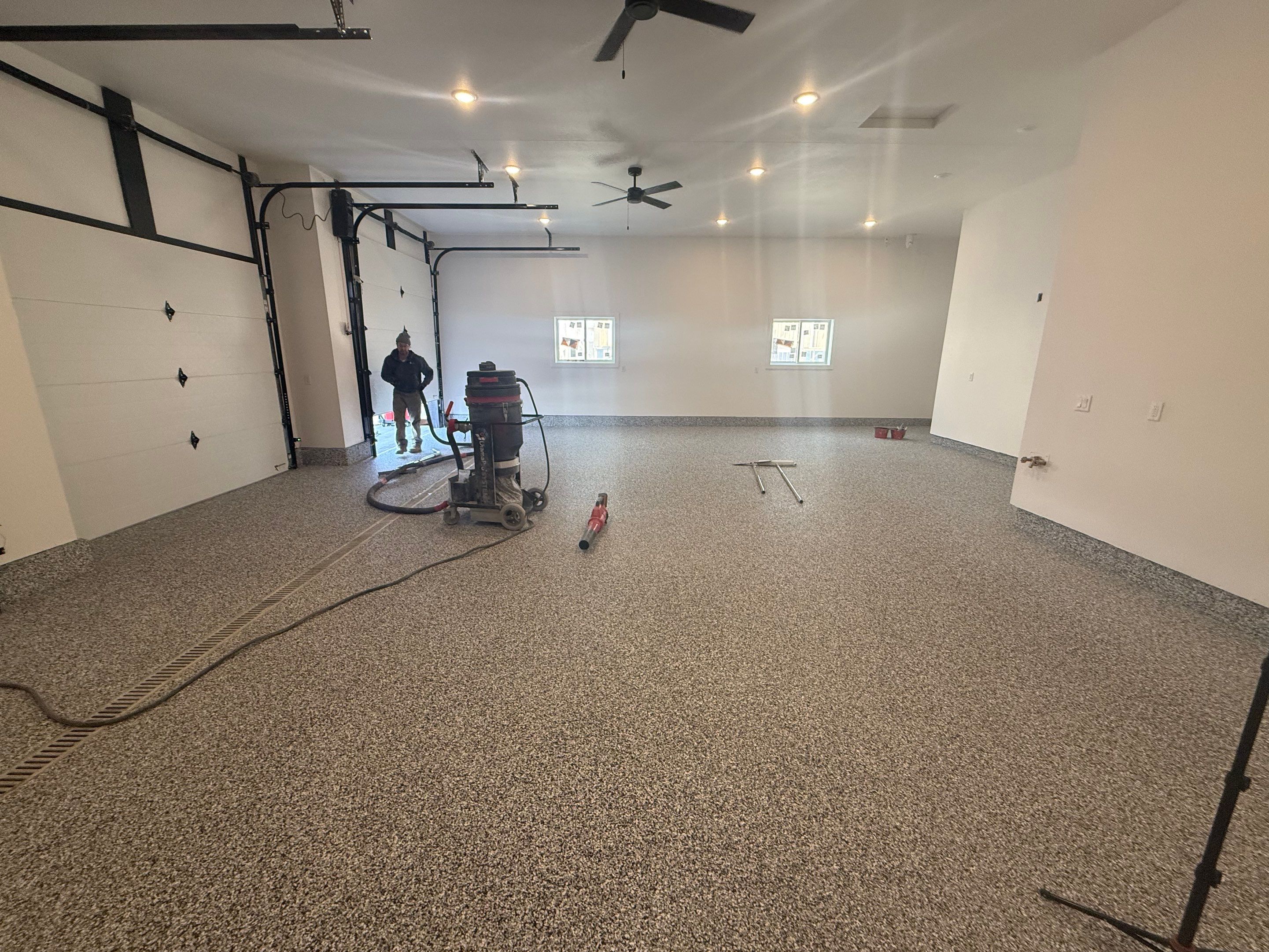 Multi-Car Garage Epoxy Floor Coating and Concrete Finishing in Sioux Falls by Select Painting, Coatings & Garage Cabinets