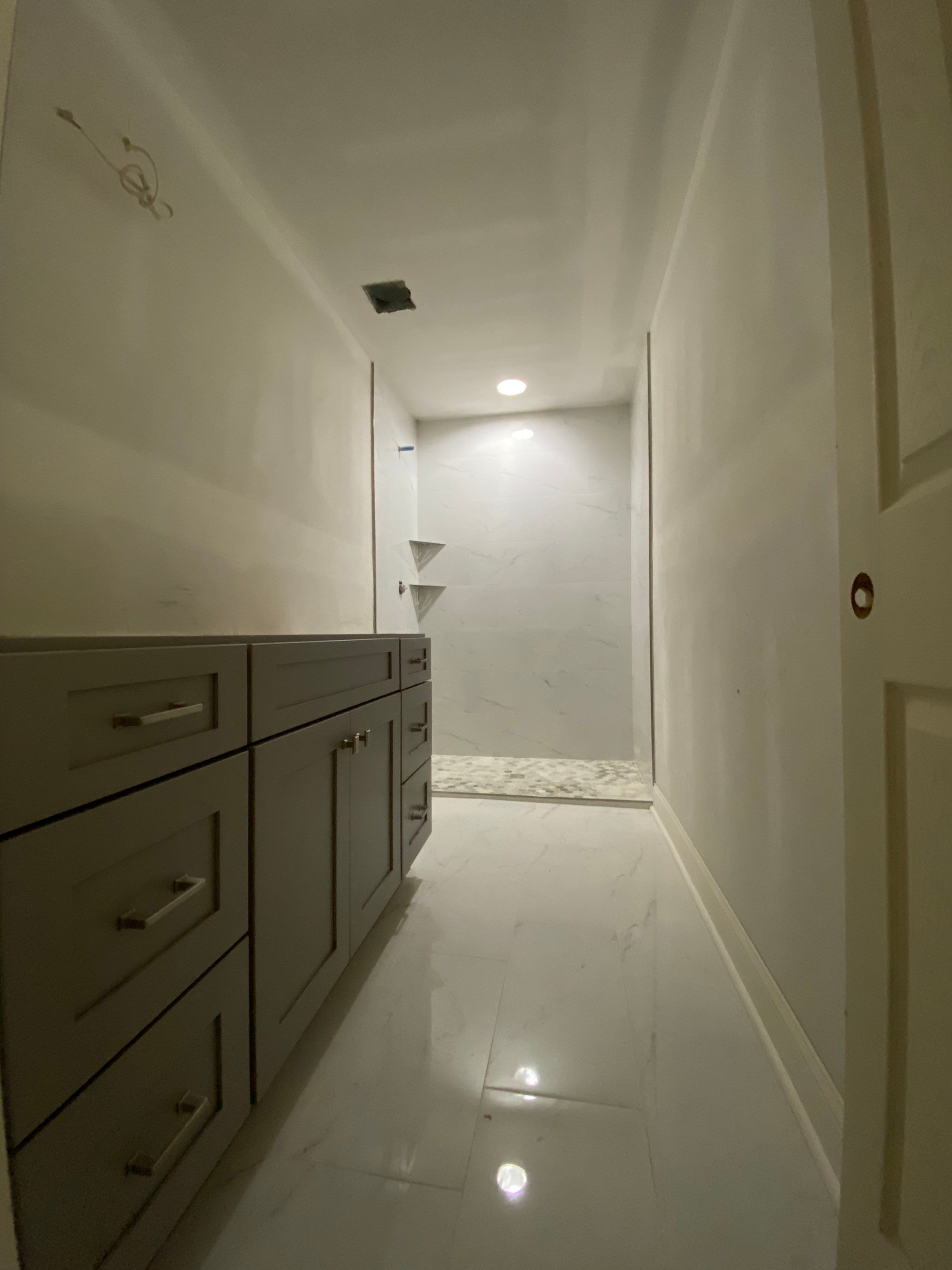 Marietta Basement Remodeling Featuring Custom Wet Bar and Marble Shower by Swift Home Renovations