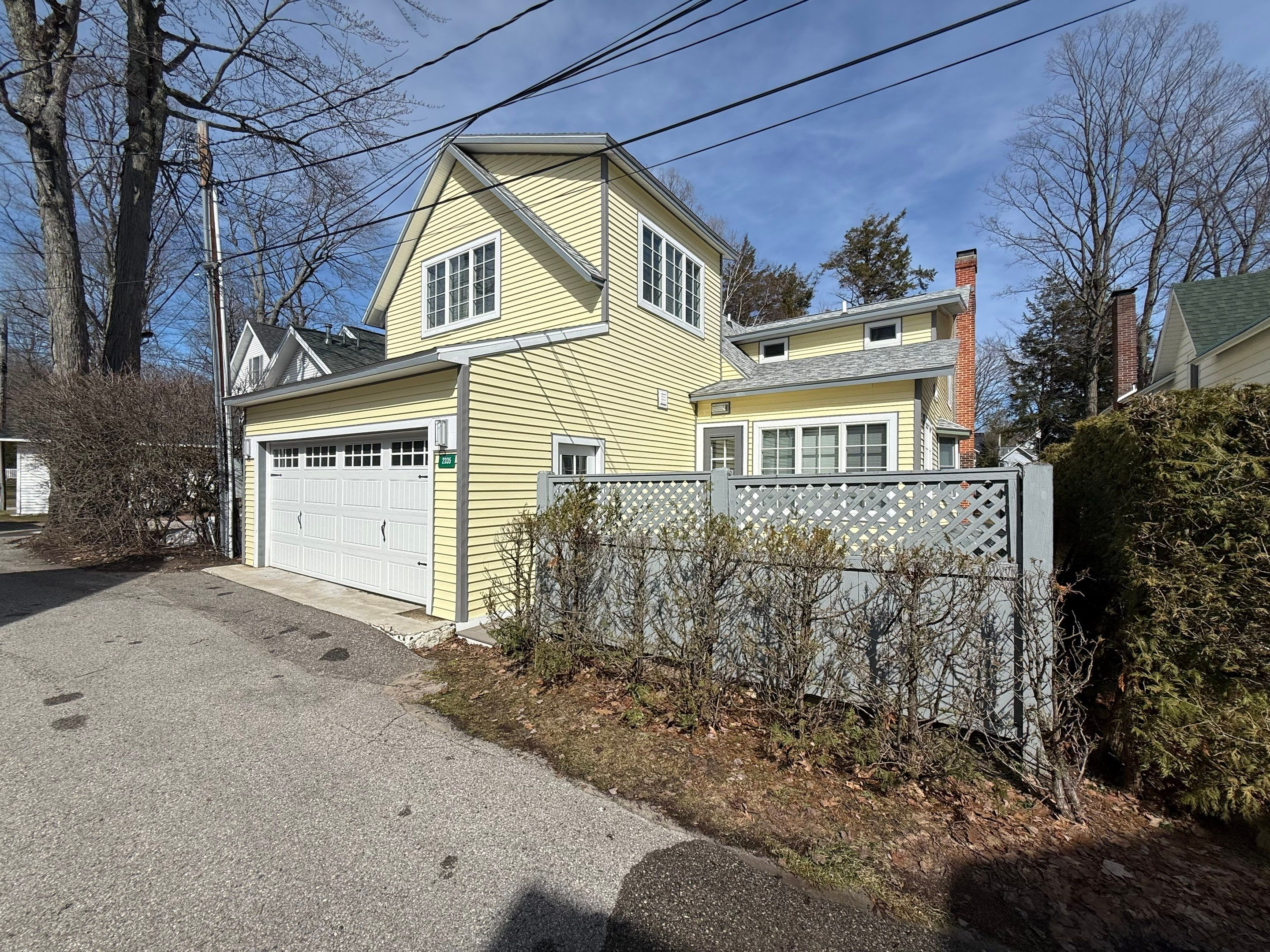 Dark Gray Aluminum Gutter System Installation in Harbor Springs by Rainbow Seamless Systems