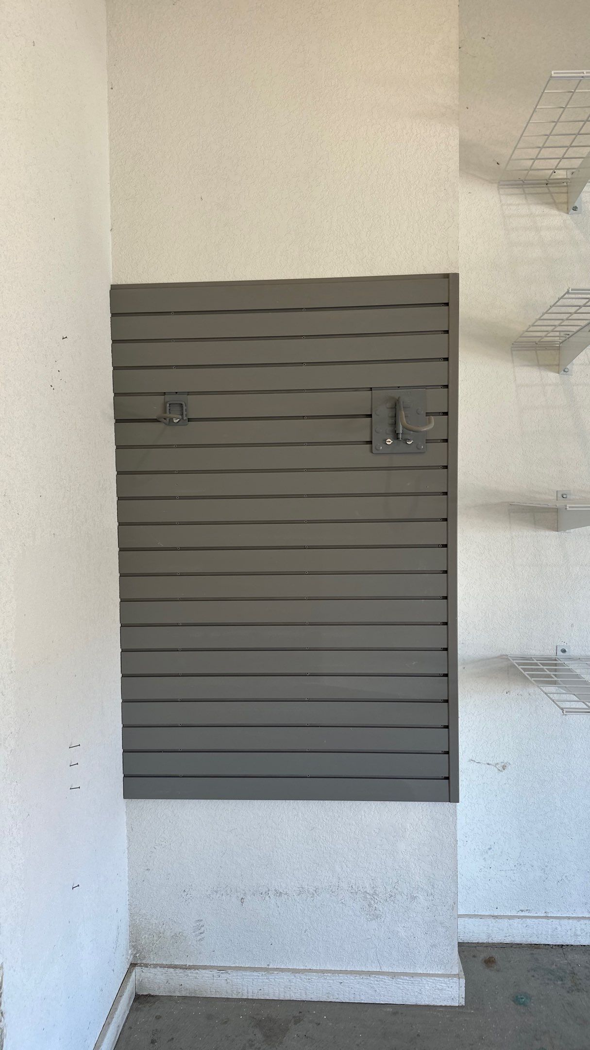 Melissa L. upgraded her garage with slatwall and overhead racks by Banner Garage