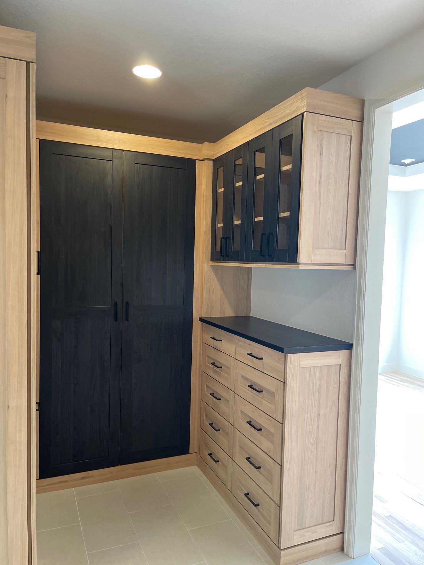 Two-Tone Closet with matching Mudroom + Laundry Room by Concept 32, Inc.