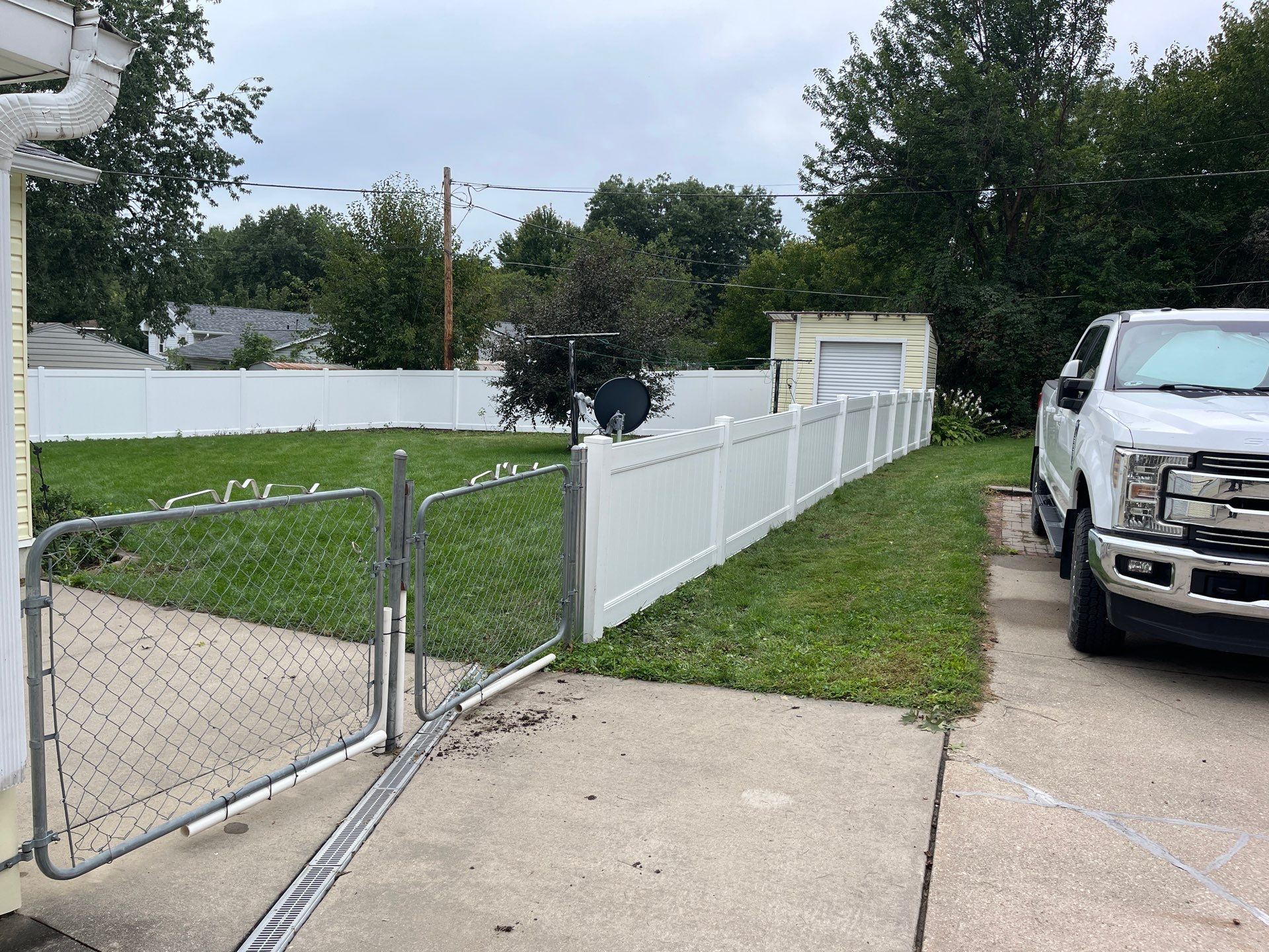 New White Vinyl Privacy Fence and Gate Installation in Waterloo by Perfect Picket Fence and Stain