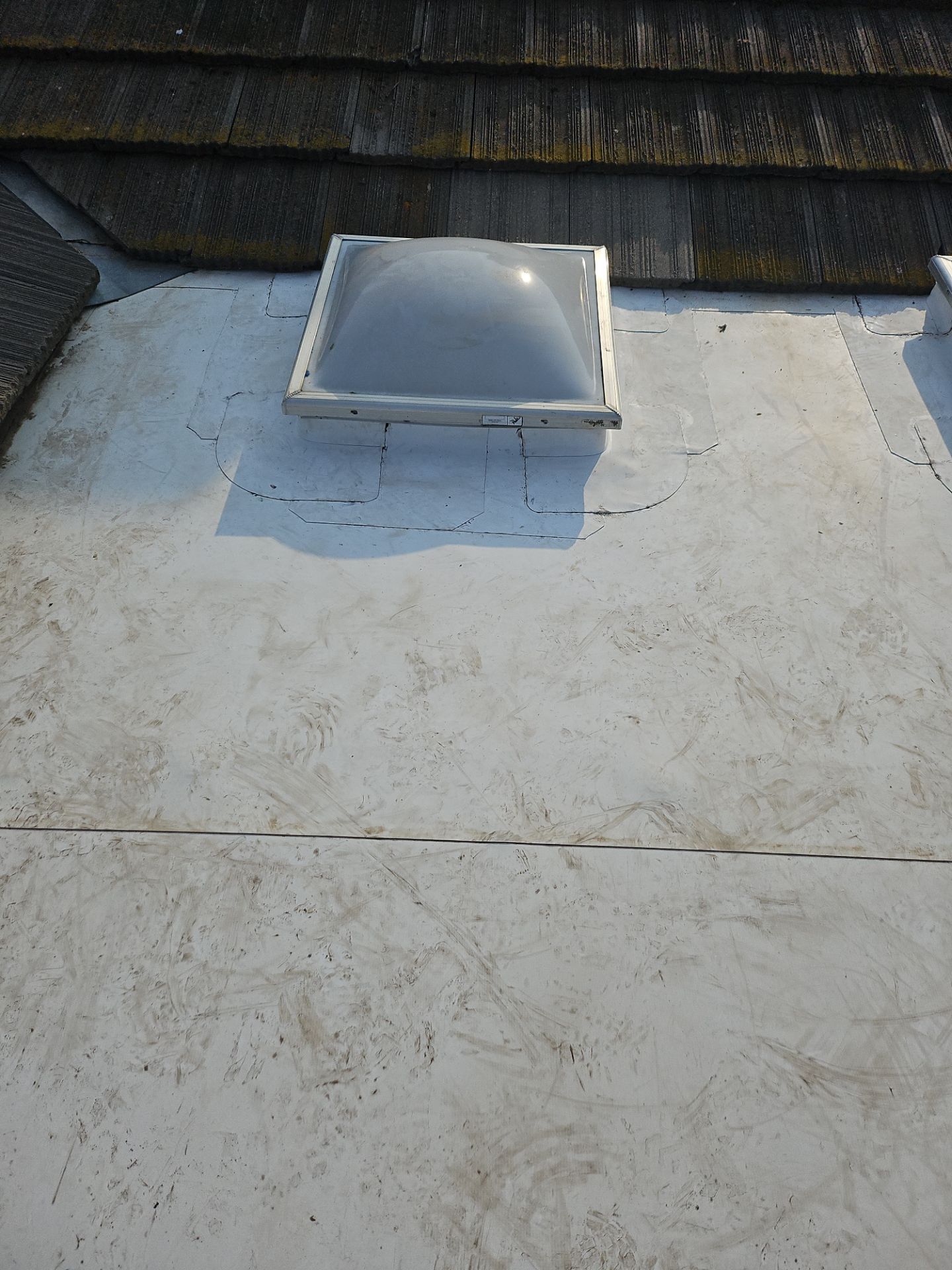 Single-ply roofing system on porch using TPO 60 mil by Straight Edge Roofing Inc