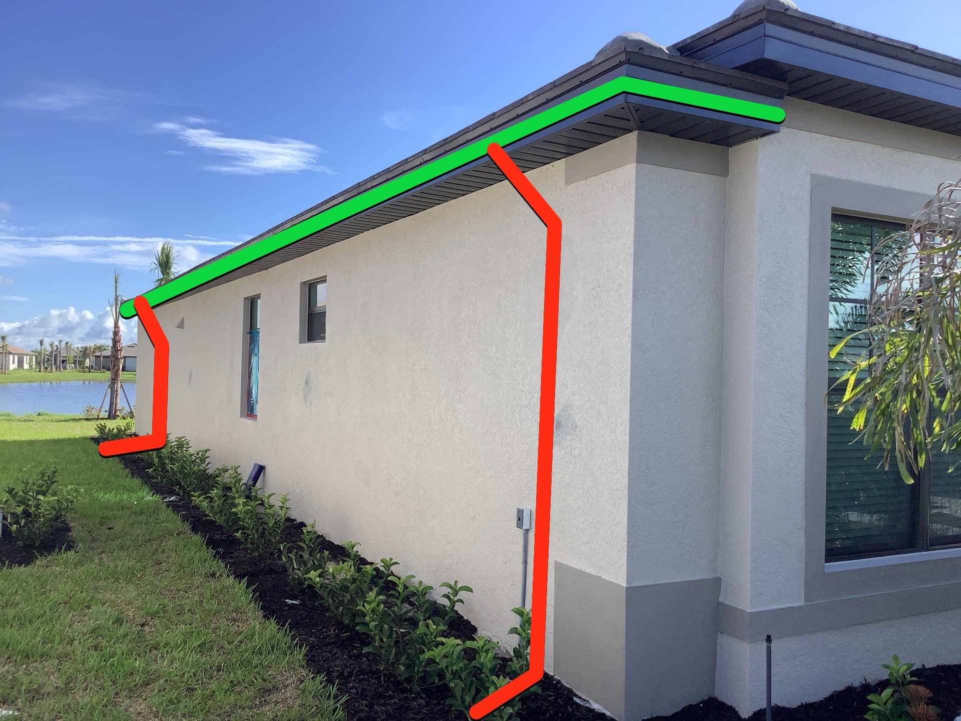 Seamless brown gutter and downspouts installation in Estero, FL  by Gutter Professors