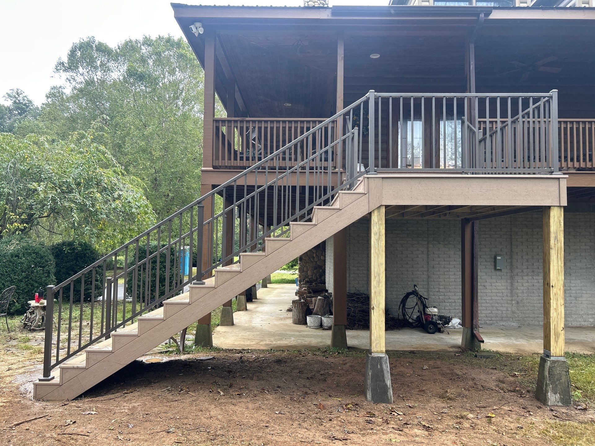 Log Cabin Wrap-Around Deck and External Staircase Installation in Caldwell by Walnut Hollow Decks & Outdoor Living