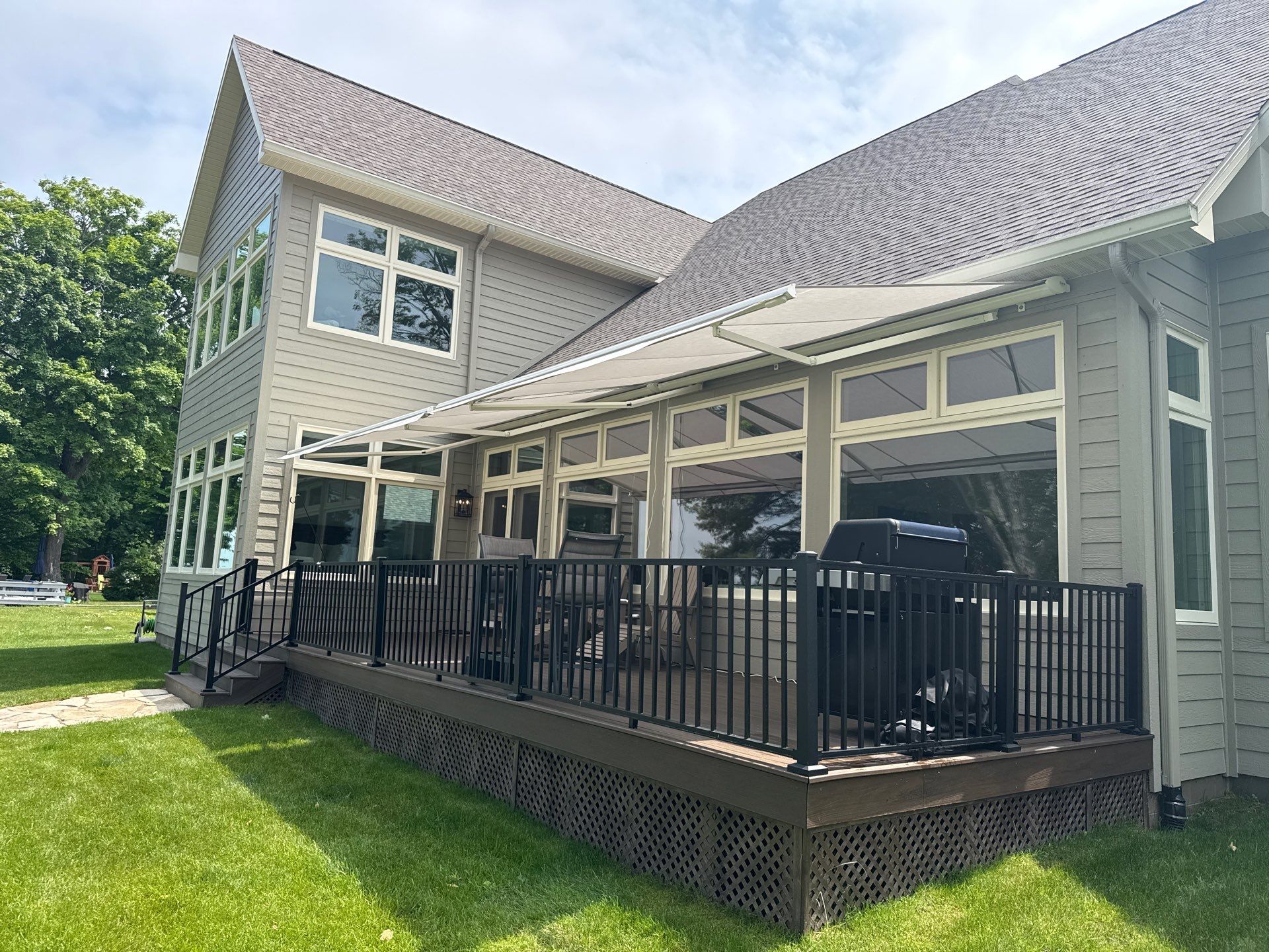Sunesta Retractable Awning Installation for Sault Sainte Marie Lakeside Deck by Rainbow Seamless Systems