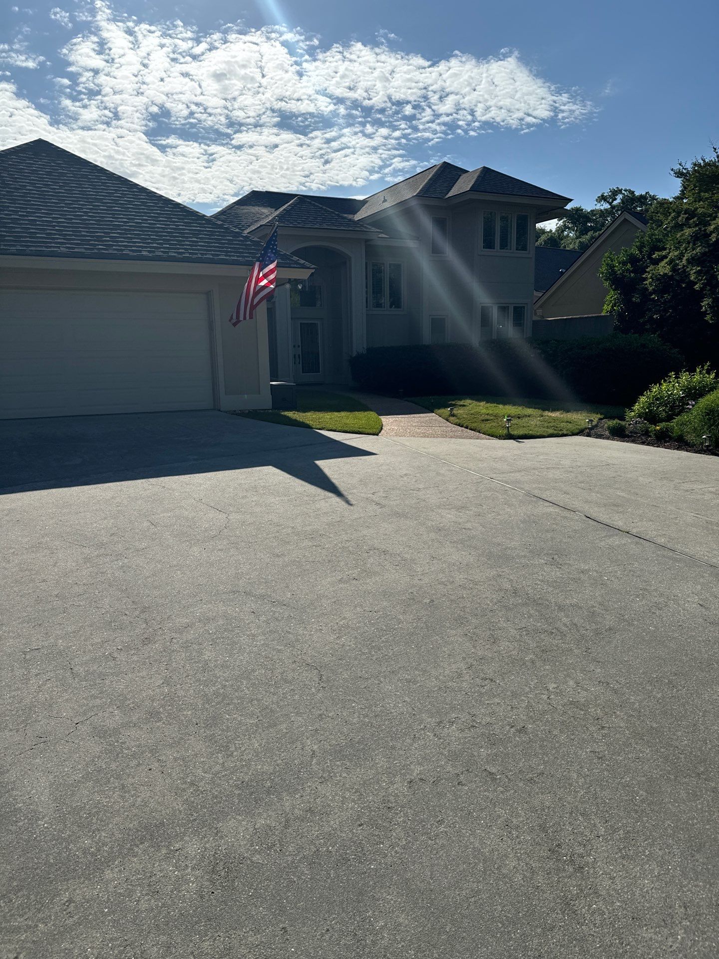 Concrete Driveway Repair with Decorative Paver Accents in Hilton Head Island by Lowcountry Scapes, LLC