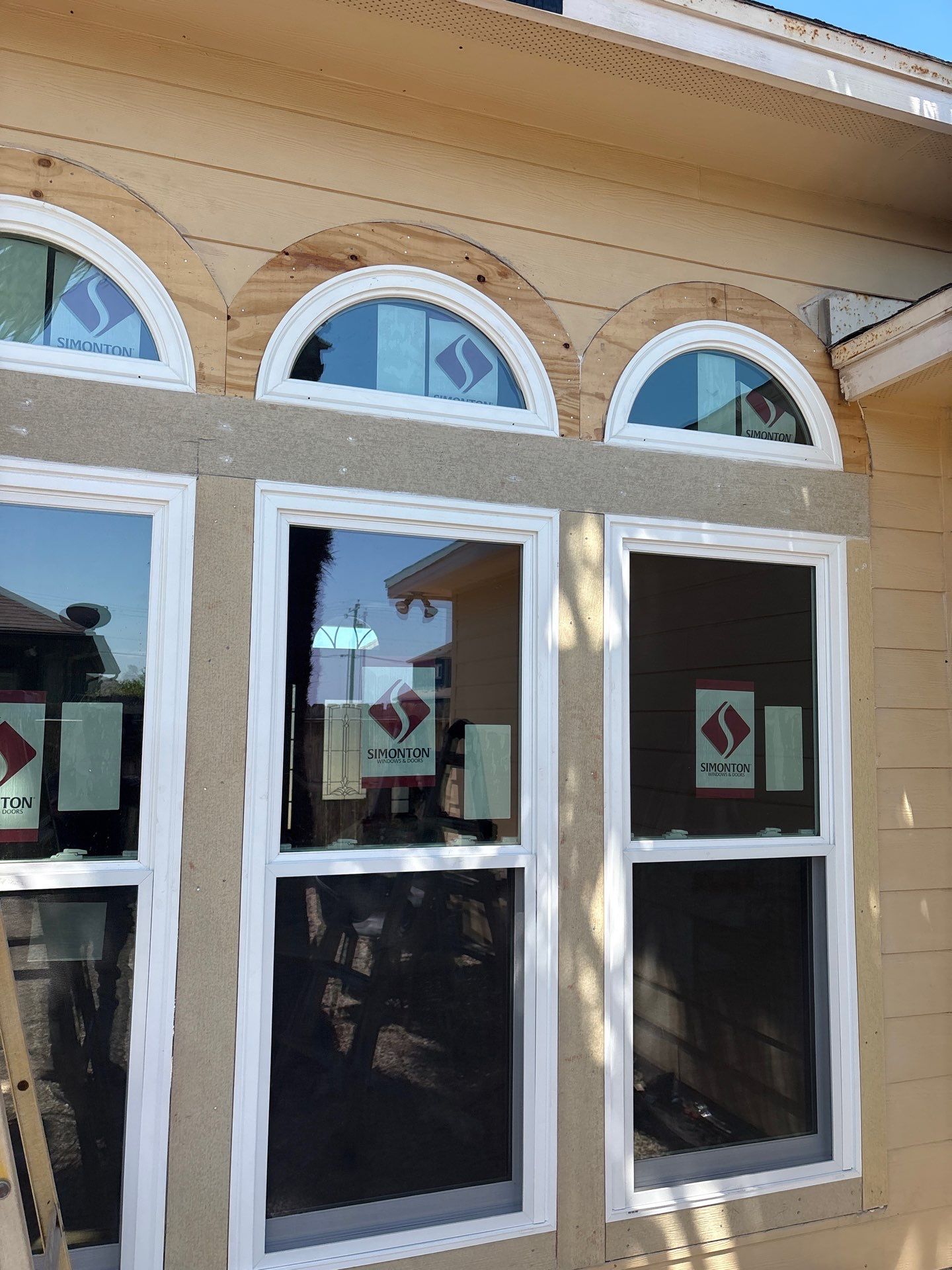 Curved Trim Windows by Bayfront Roofing and Construction