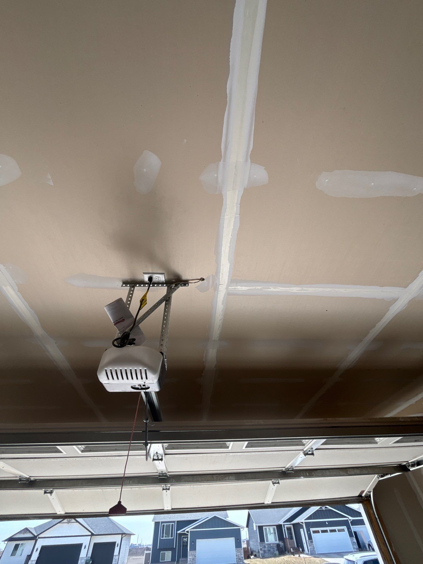 Grey Flake Epoxy Garage Floor Coating in Sioux Falls by Select Painting, Coatings & Garage Cabinets