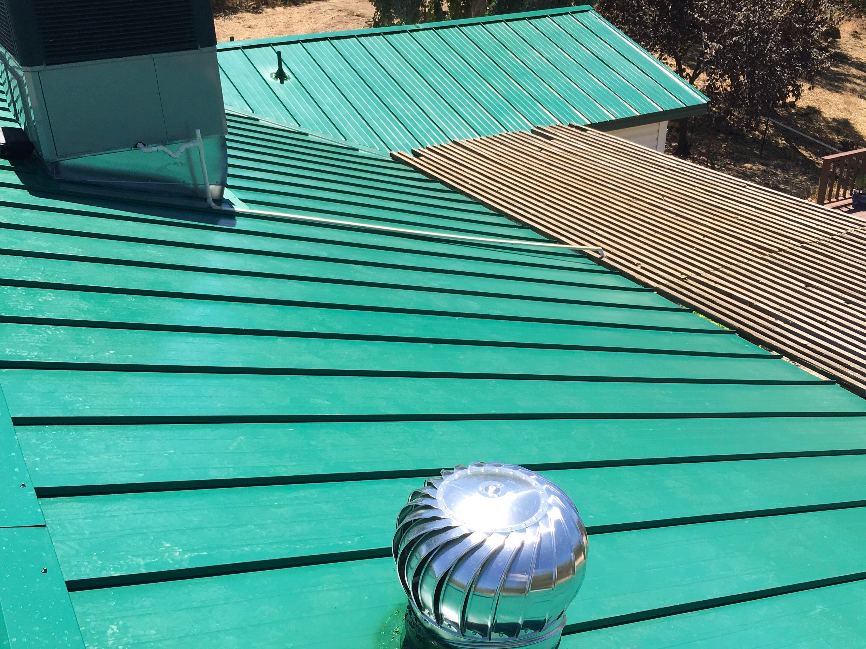 Metal roofing installation using Standing seam metal roofing system by Straight Edge Roofing Inc