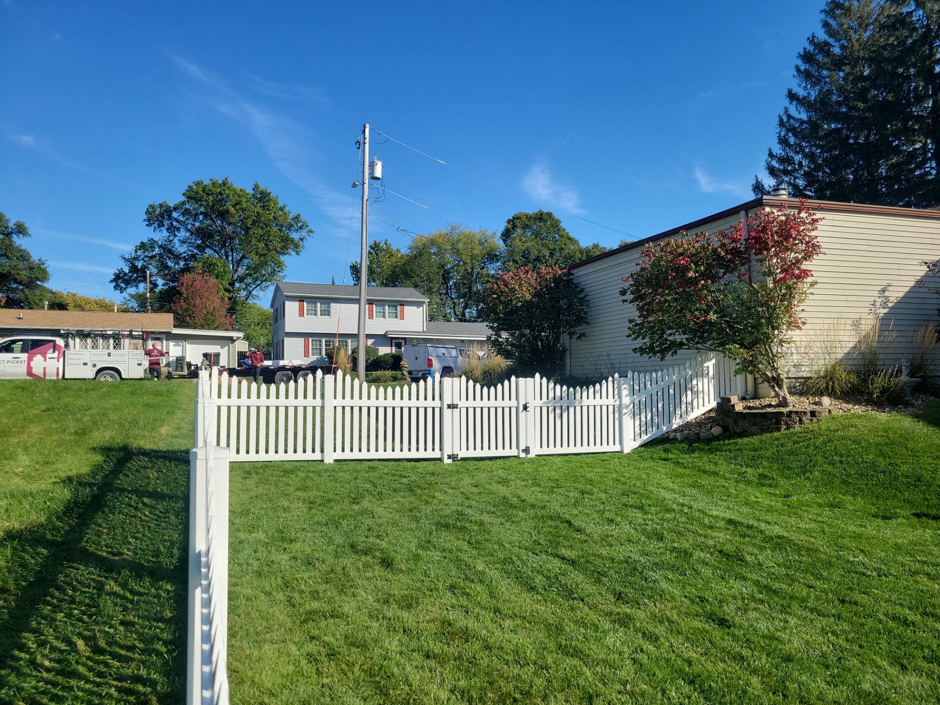 White Vinyl Spaced Picket Fence Installation in Waterloo by Perfect Picket Fence and Stain