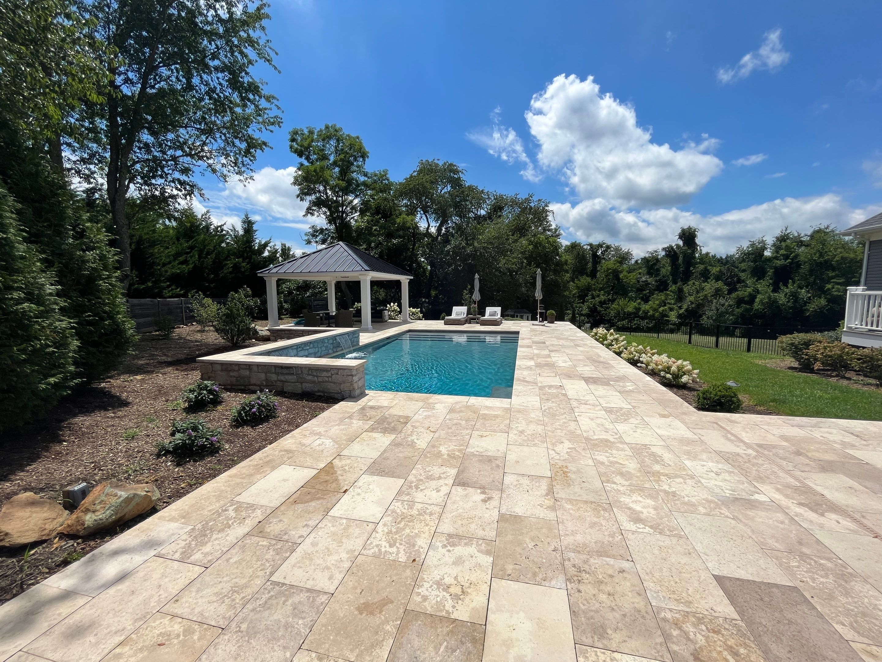 Gunite Pool w/ Raised Wall and Waterfalls by Elysium Pools