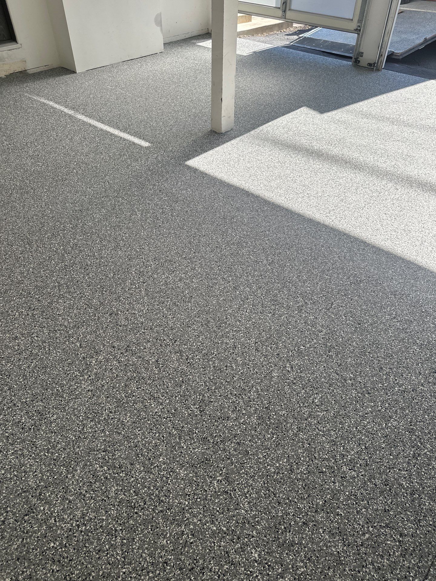 Polyurea Garage Floor Coating with Simiron Wombat Chip Finish by MGP Coatings