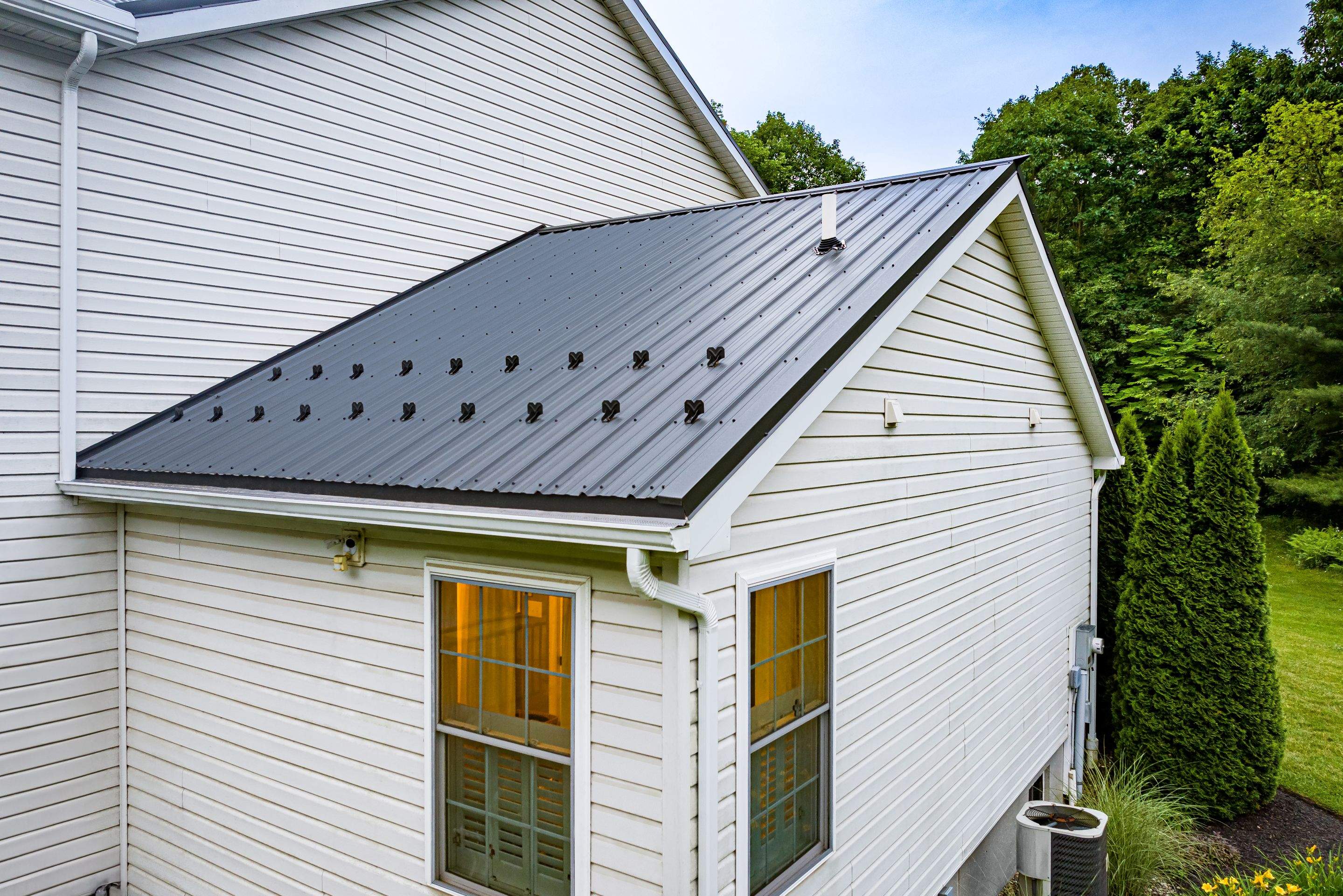 Metal roof install- shadow gray by Esh Builders