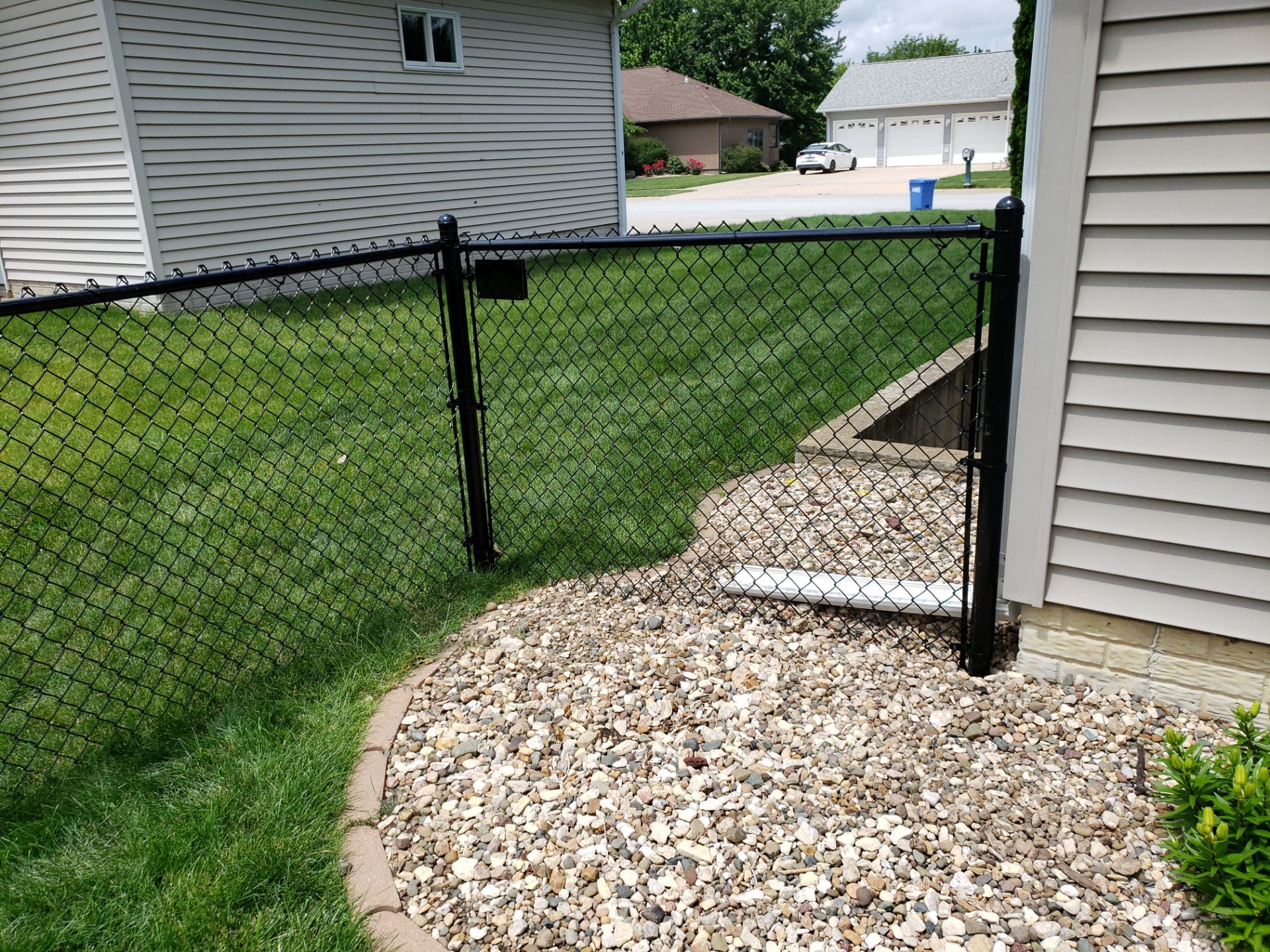 Black Vinyl-Coated Chain Link Fence Installation in Denver by Perfect Picket Fence and Stain