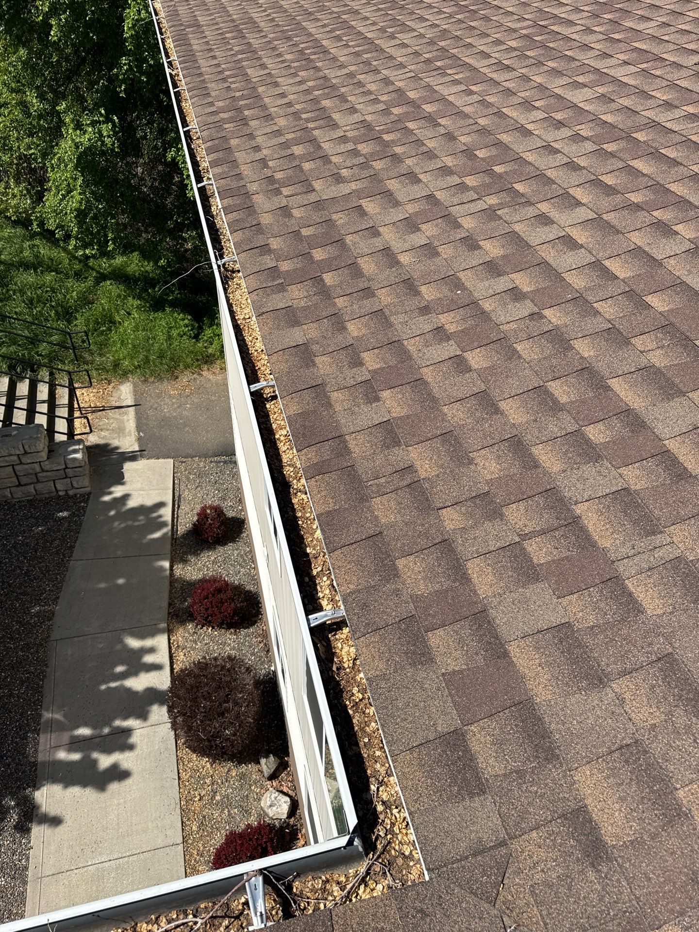 Commercial gutter cleaning Walla Walla, WA before photo with filled gutters