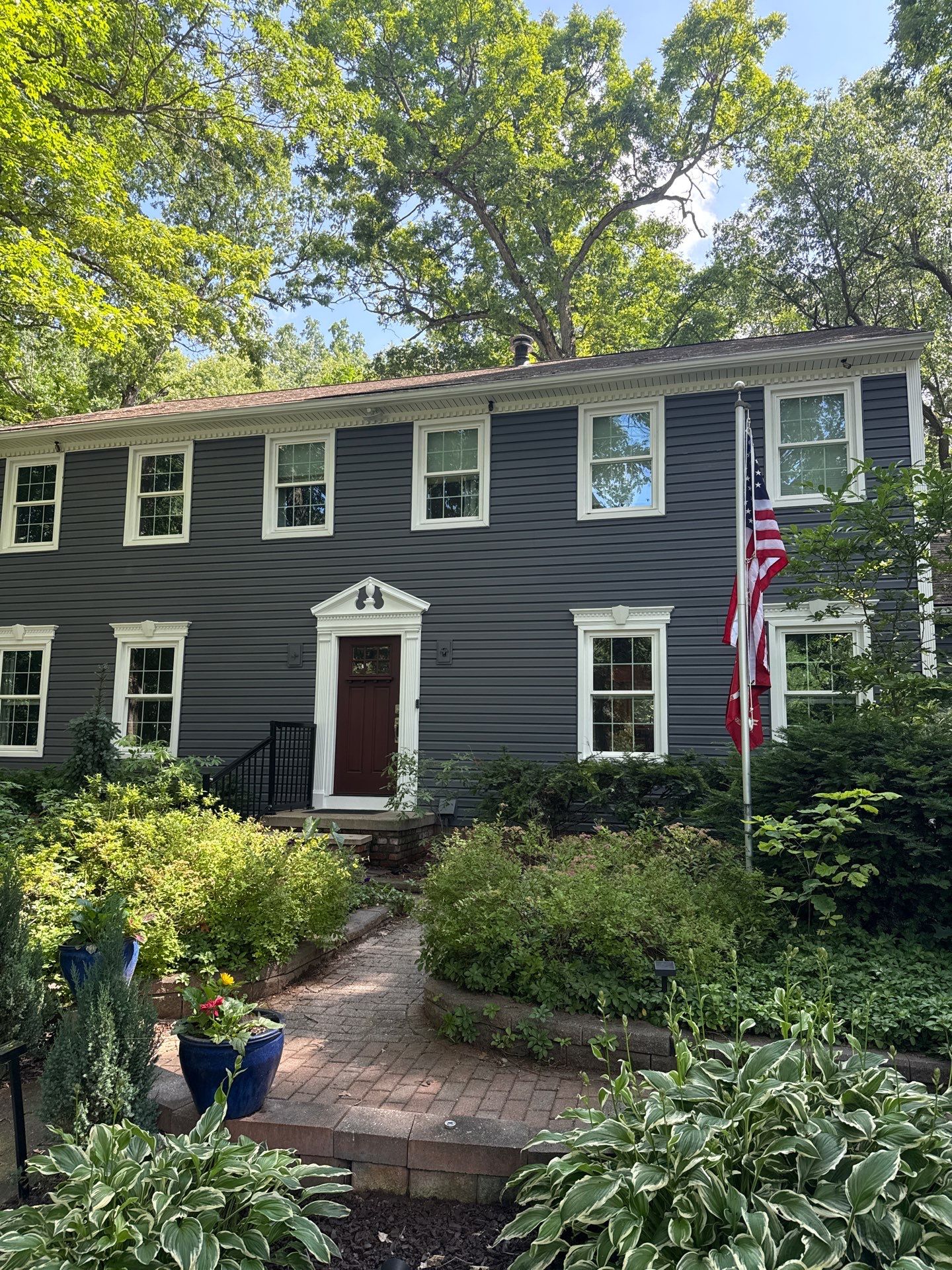 Vinyl Siding and Exterior Trim Repair for Brighton Residence by Top Shelf Painter