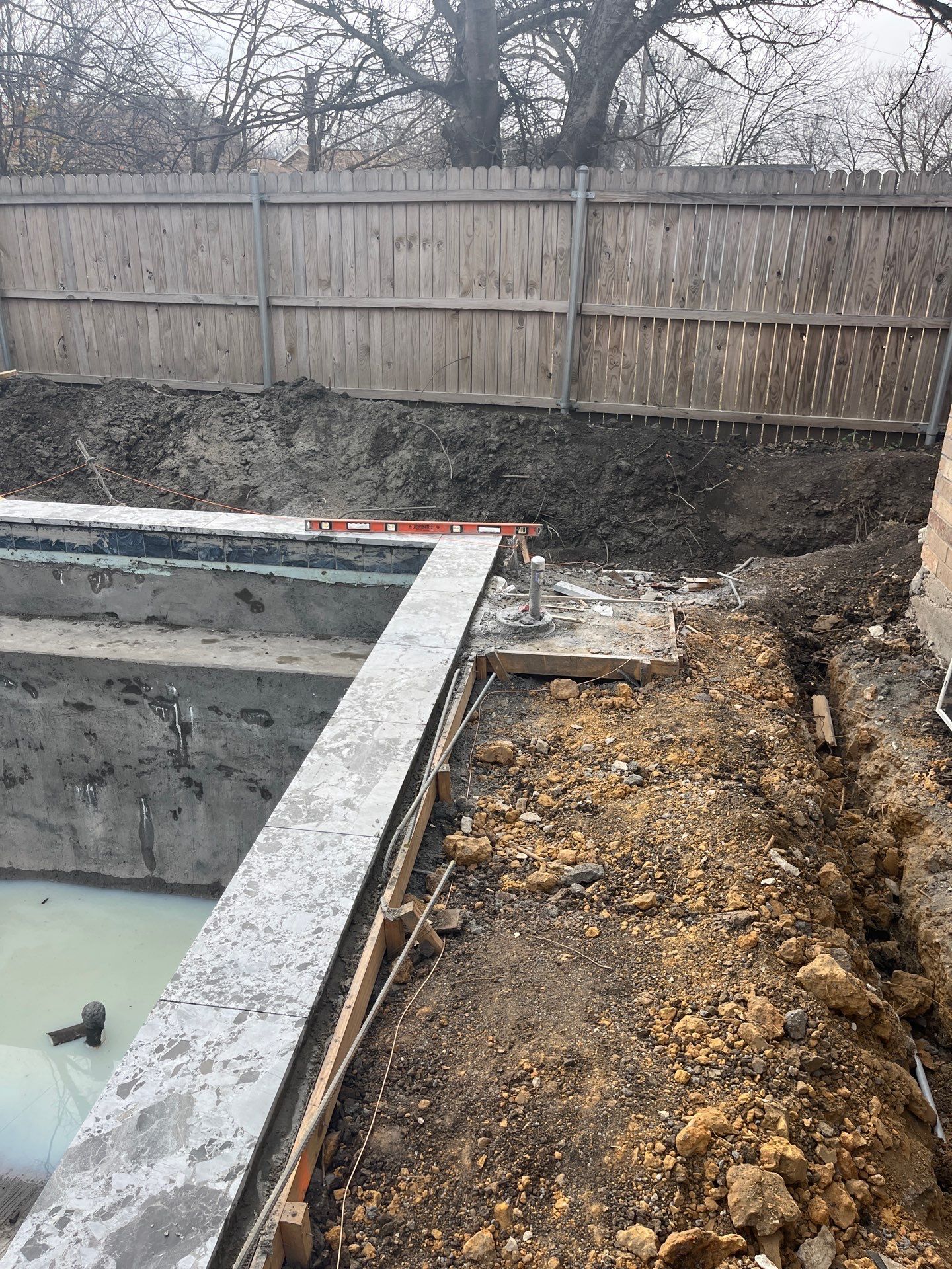 Geometric Pool with Stone Waterfall Wall by Pinnacle Pools and Spas - DFW
