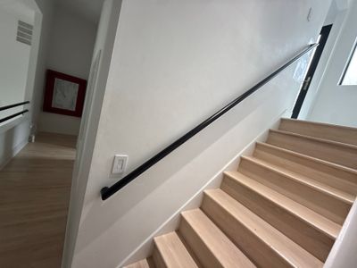 Two Black Metal Handrail Installation Across Multi-Level Washington Staircases
