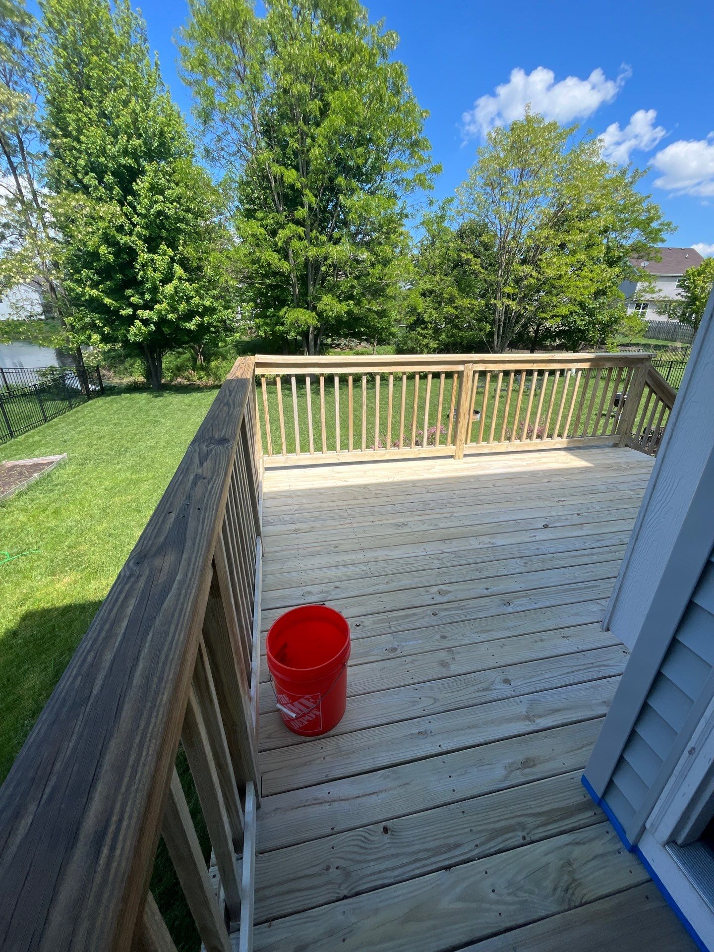 wood deck cleaning and staining by Northern Power Washing LLC.