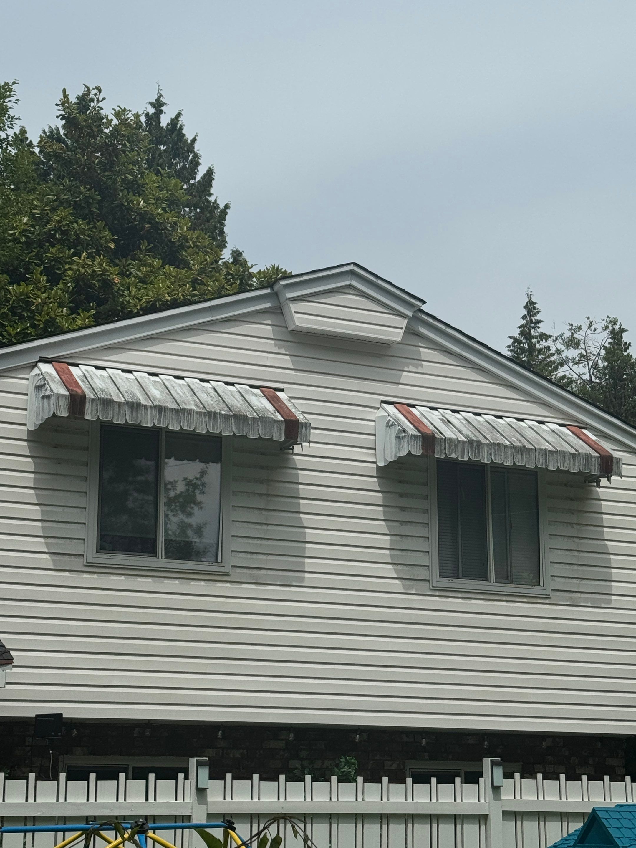Repair Damaged Gutter & Power Wash House Siding by YVR Construction Group