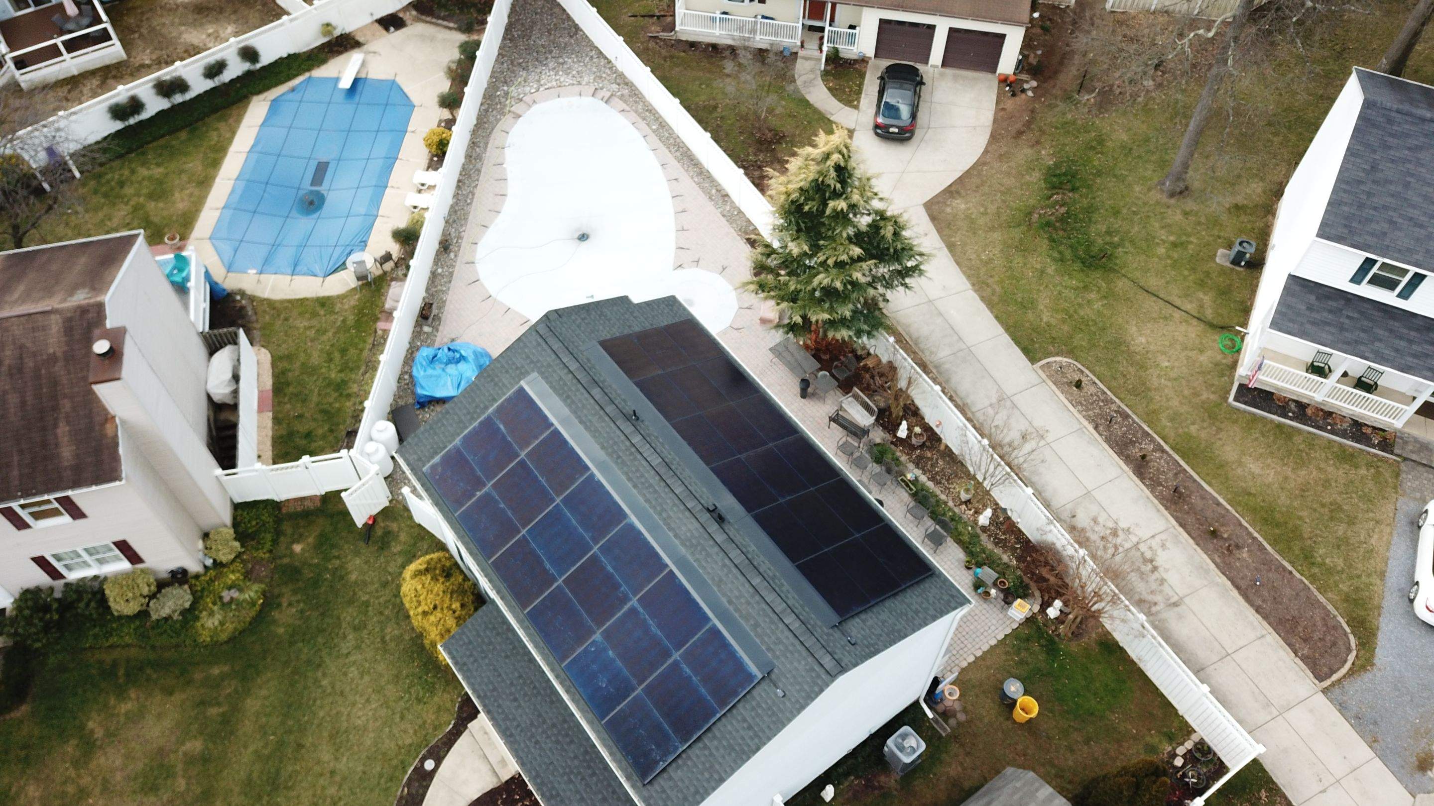 Roof Replacement with GAF Decotech integrated solar panels by American Home Contractors