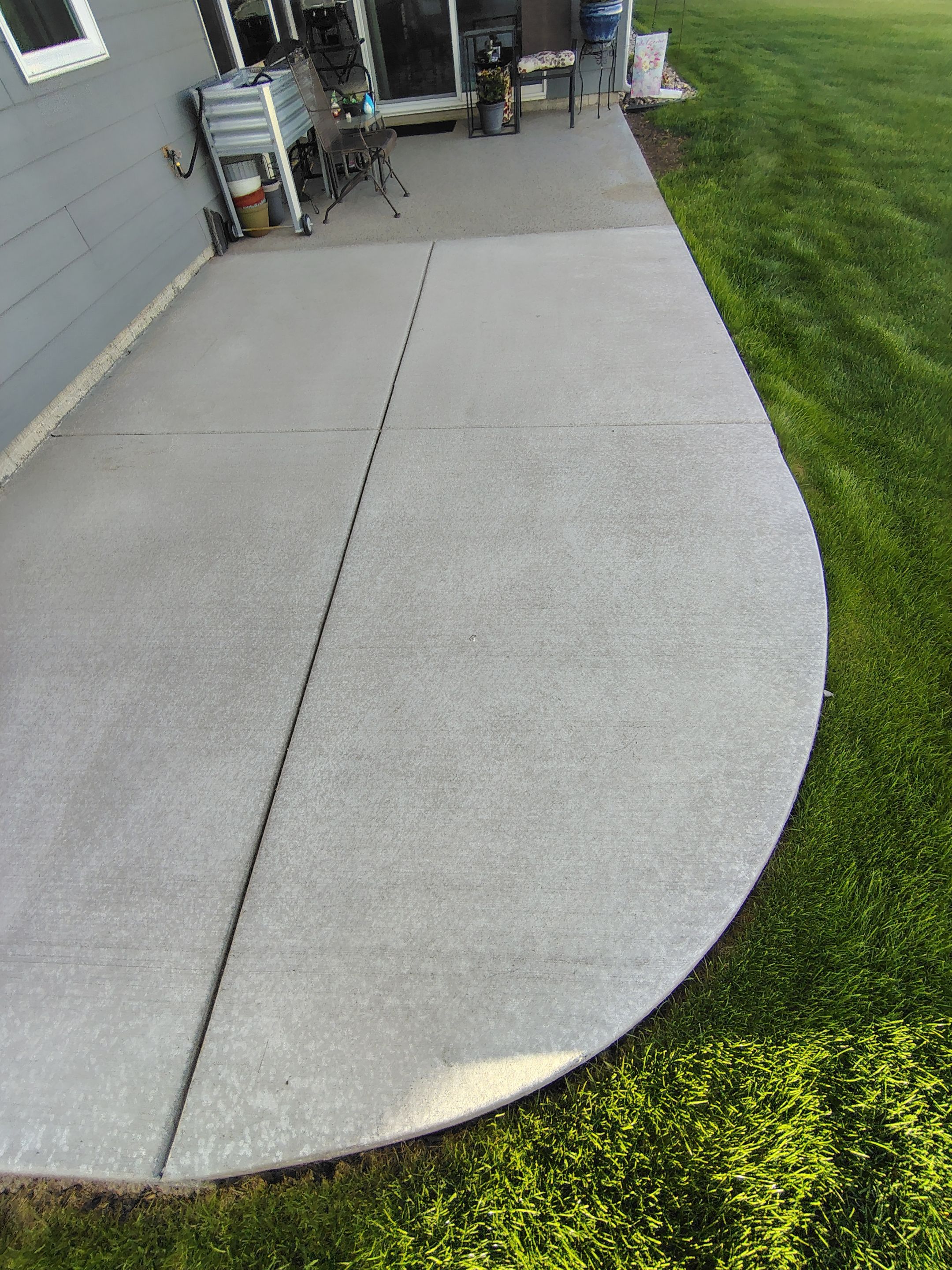 Speckled Concrete Patio Coating Installation in Sioux Falls by Select Painting, Coatings & Garage Cabinets