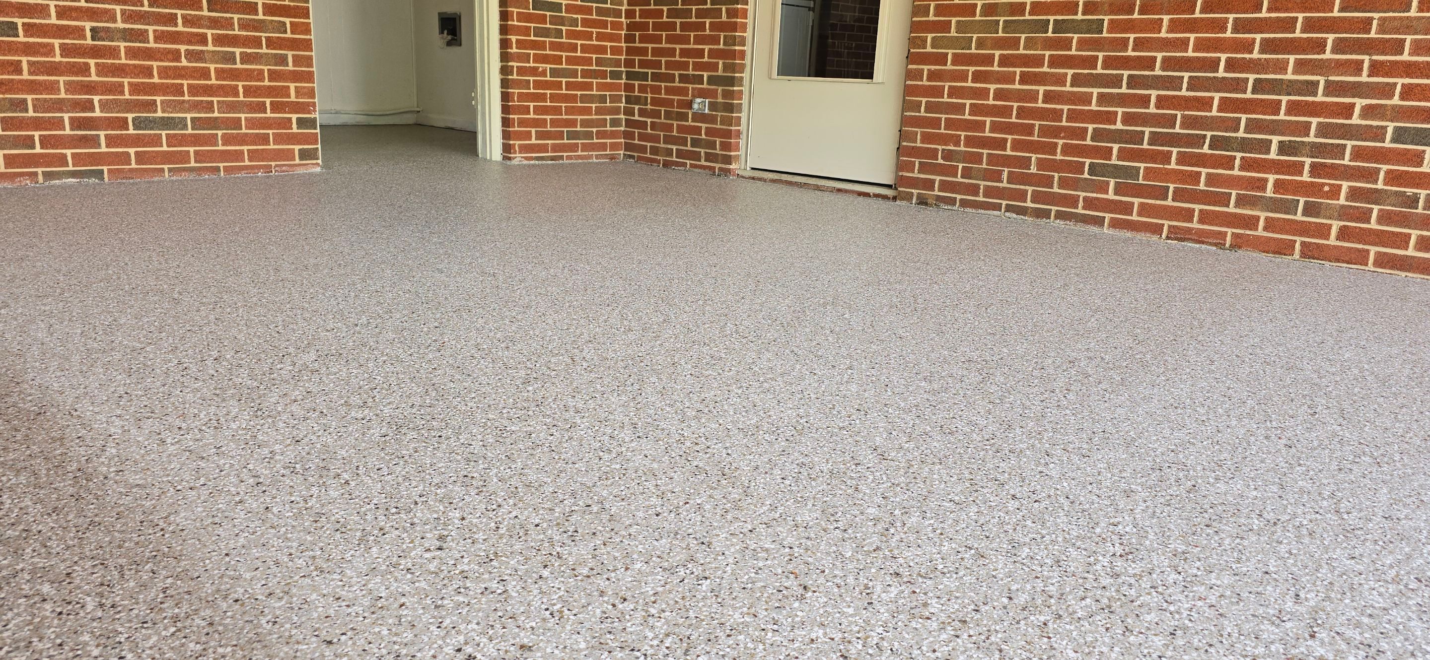 Back Patio using Creekbed by Elite Floor Solutions