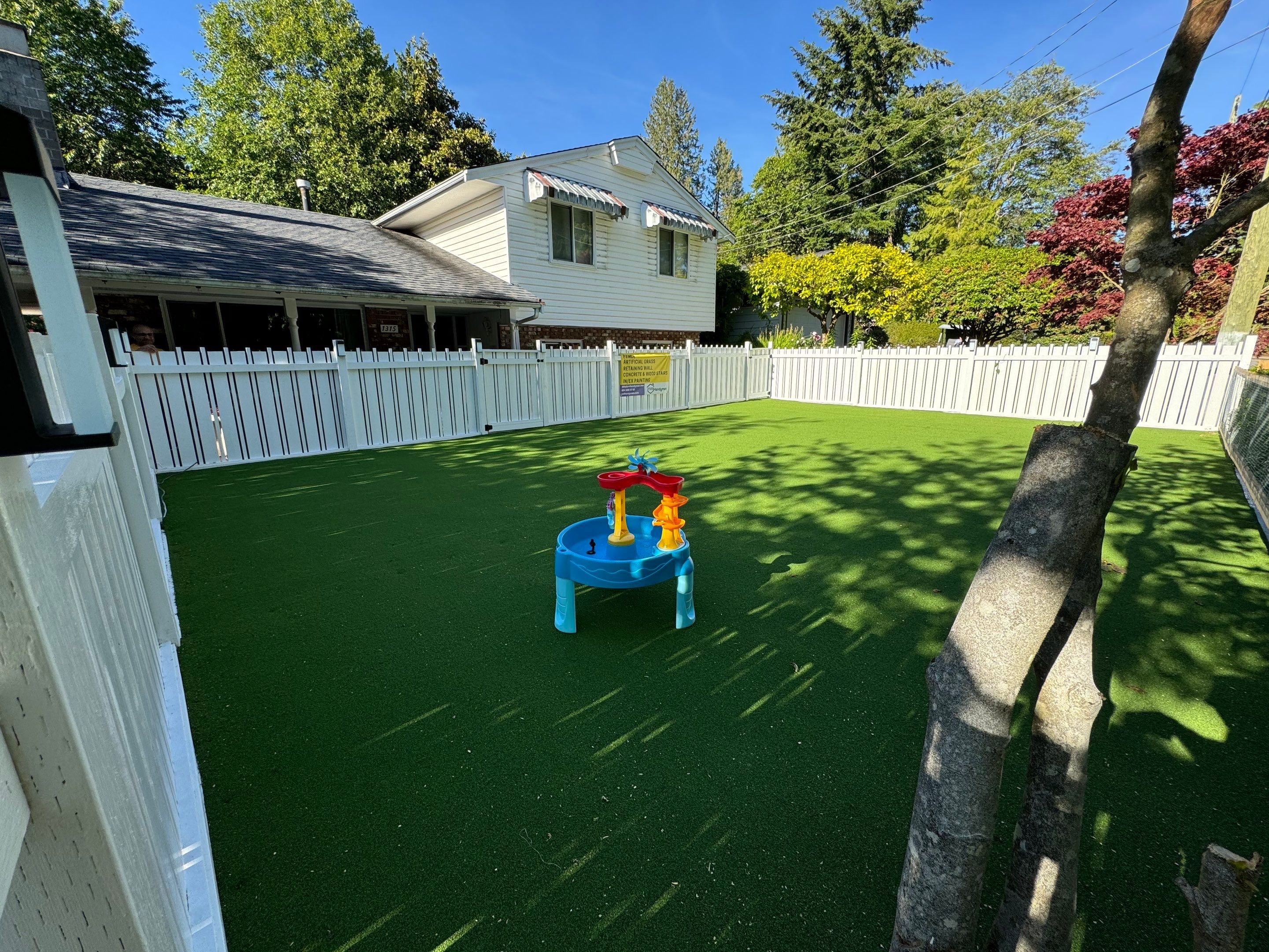 Artificial Grass and Custom Fence For KidiKare Daycare by YVR Construction Group