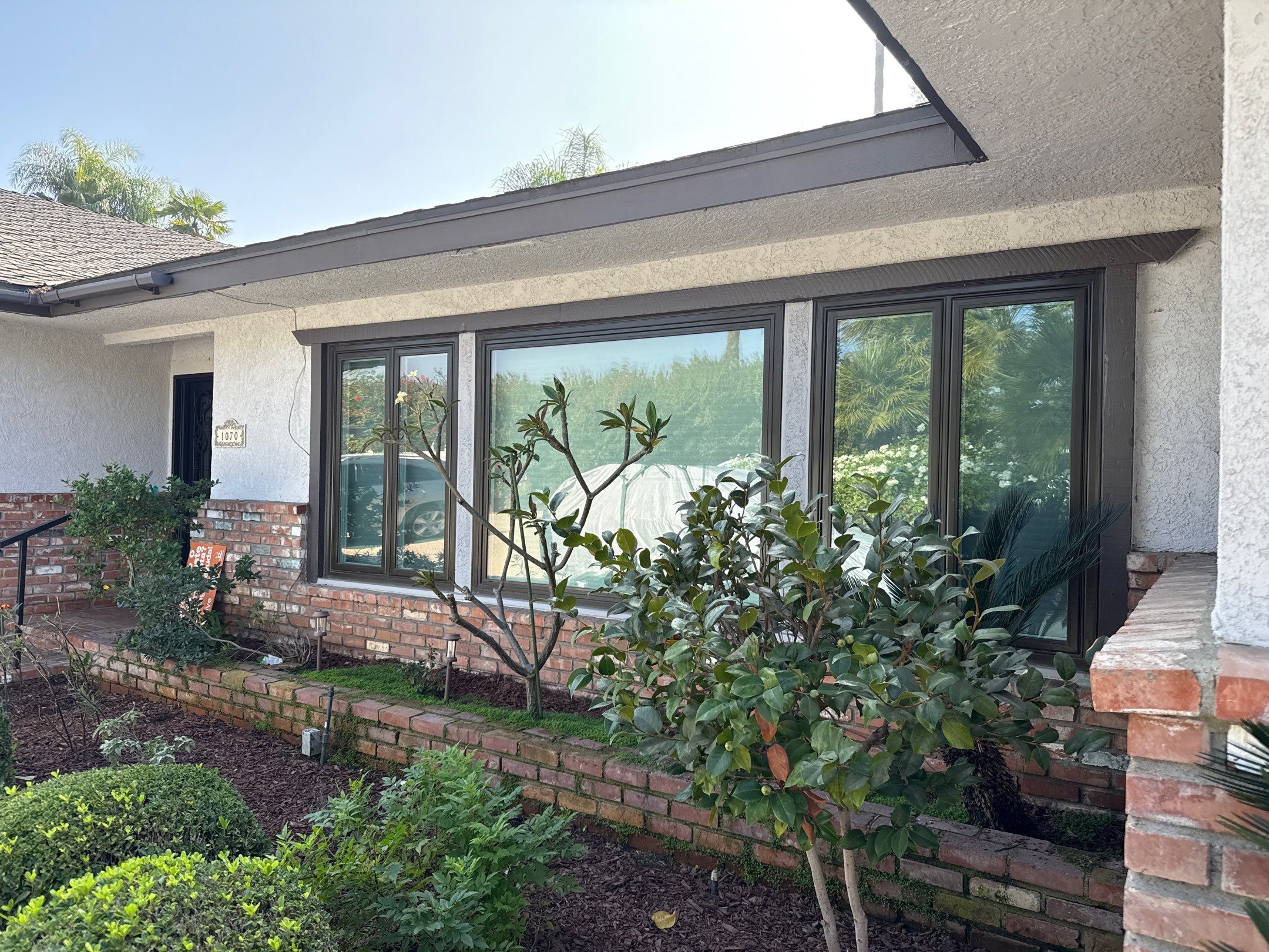 New Dark Frame Milgard Window and Sliding Door Installation in Covina by American Window Company