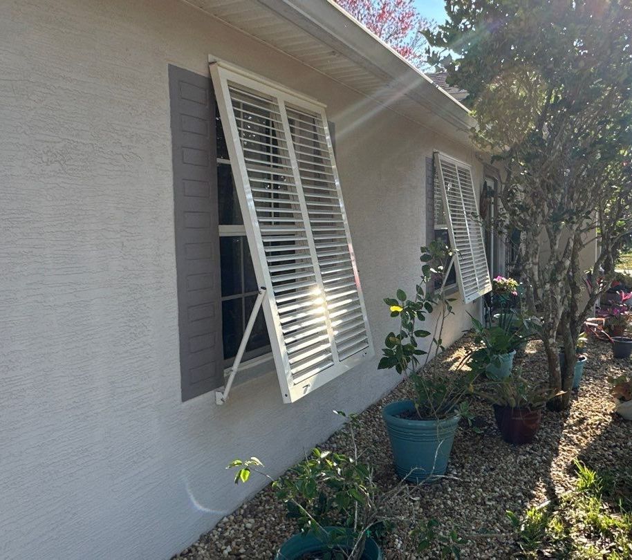 Hurricane Rated Bahama Shutters in Cream by Smart Guard Shutters