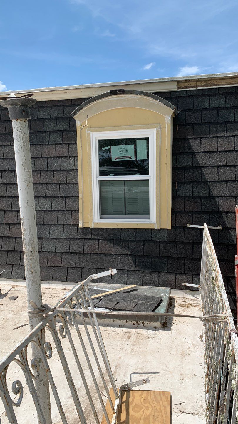 Mansard Charm by Bayfront Roofing and Construction