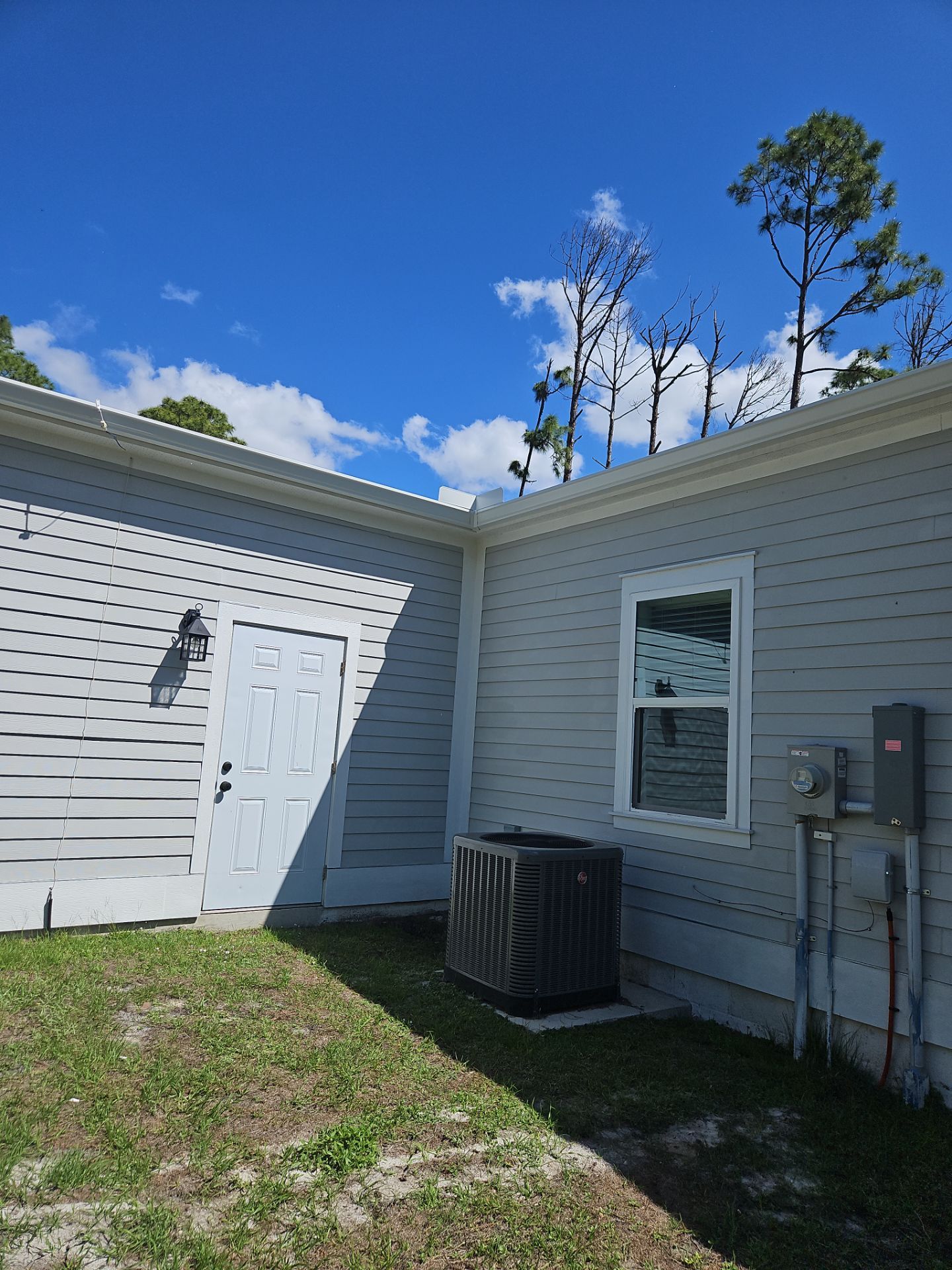 Downspout Installation using 3X4 Elbow Downspout in Port Charlotte FL by Gutter Professors