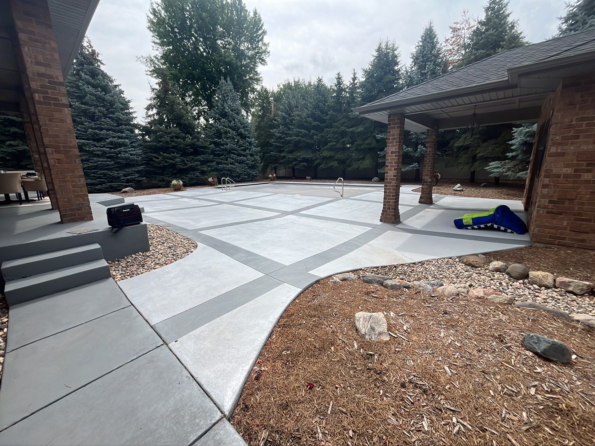 Decorative Concrete Pool Deck and Patio Resurfacing in Sioux Falls by Select Painting, Coatings & Garage Cabinets