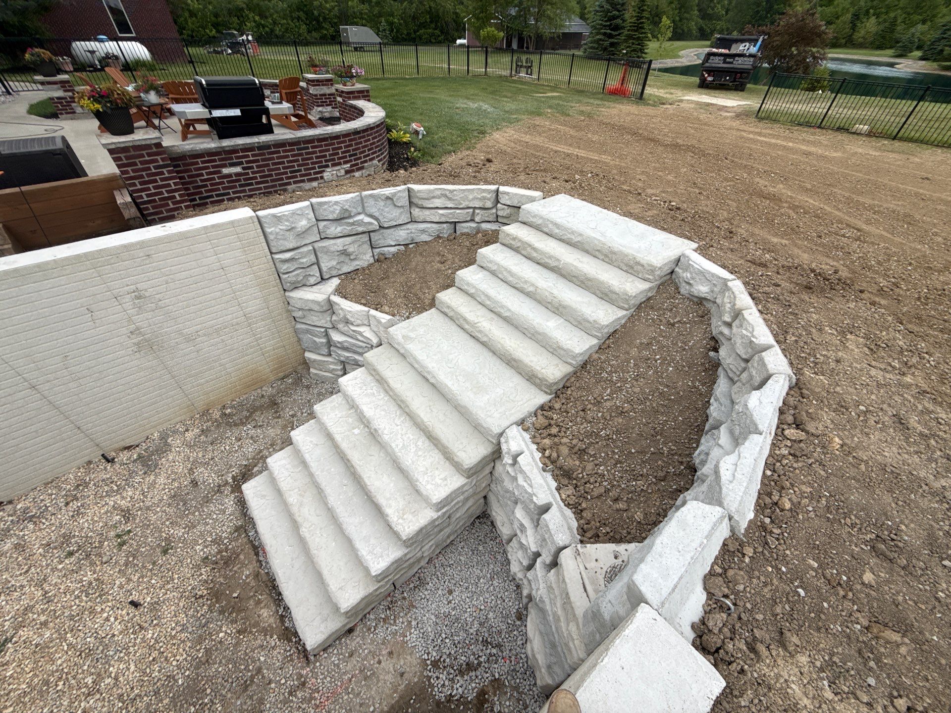 Basement Walkout Construction with Tiered Retaining Walls in Berkey by Farrell's Lawn & Garden Center LLC