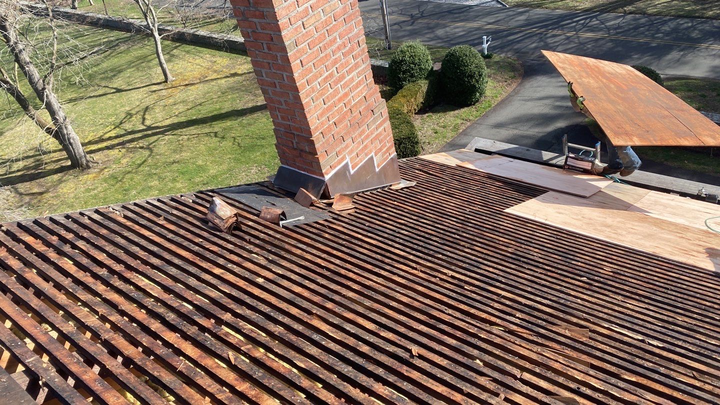 Residential Roofing Installation using Vermont Slate by A Plus Exterior