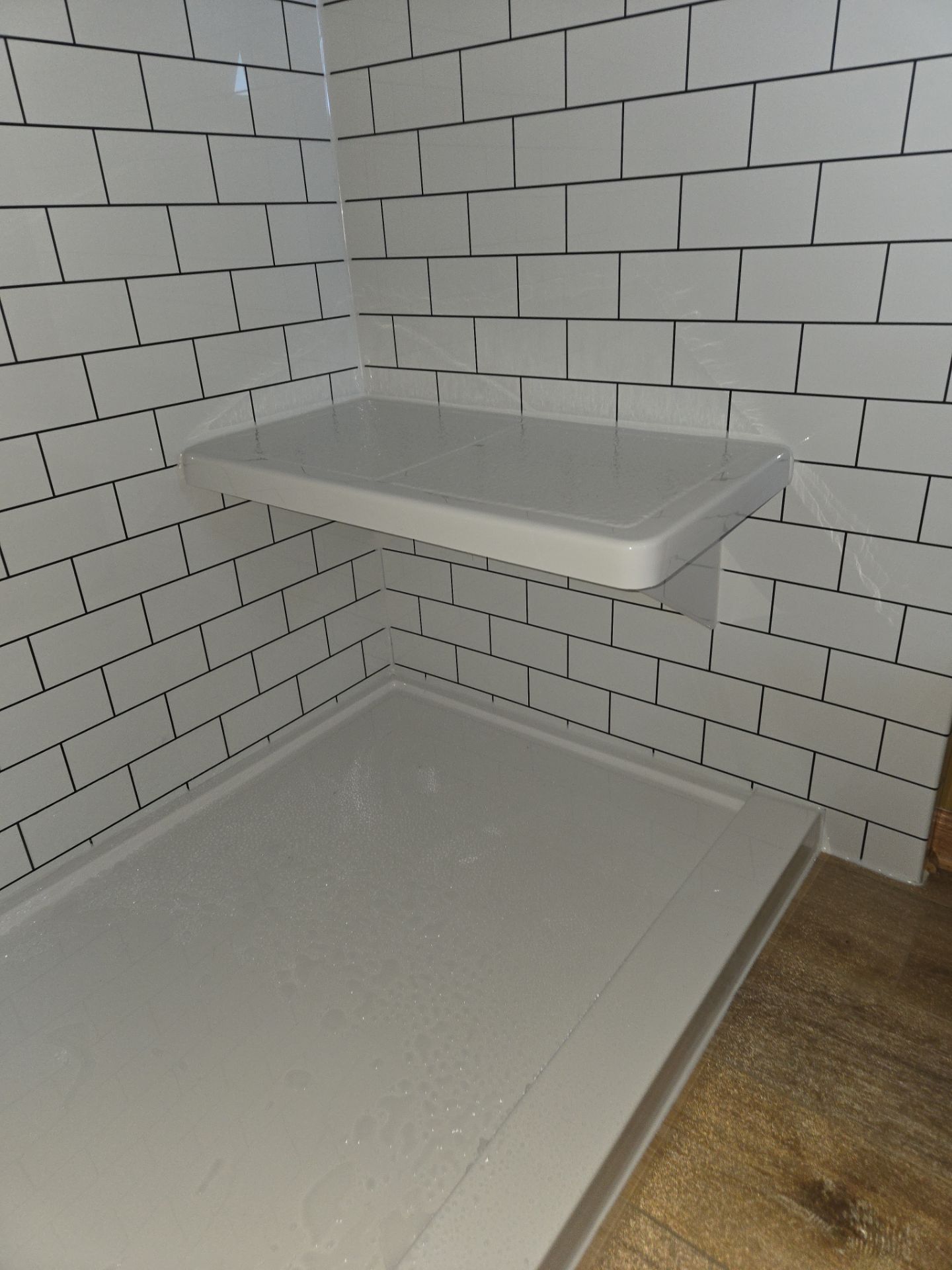 Bathroom Remodel using Luxury Vinyl Plank by The Shower Company