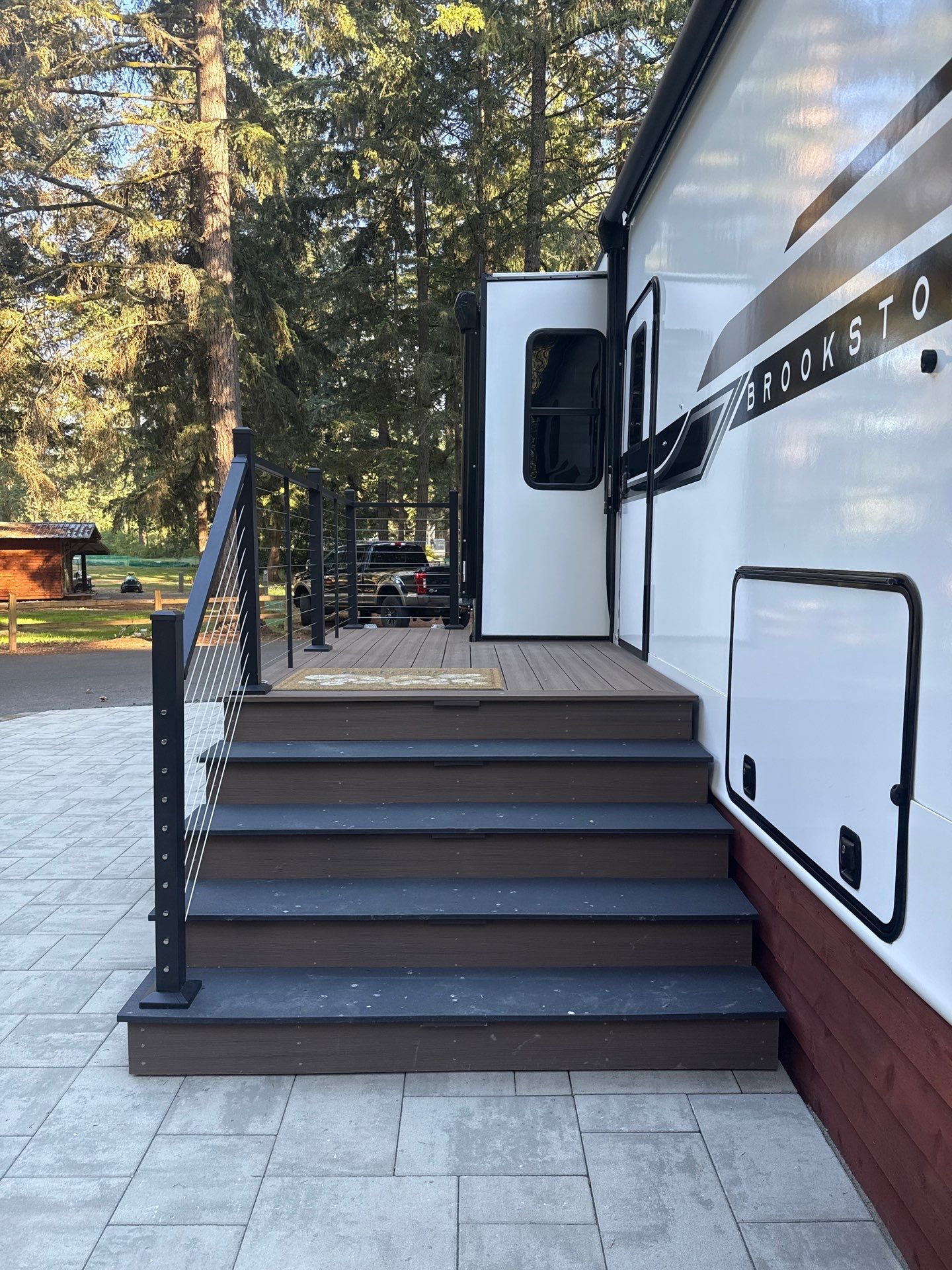 Custom Composite Deck with Cable Railing and Paver Patio in Olympia by Expedeck