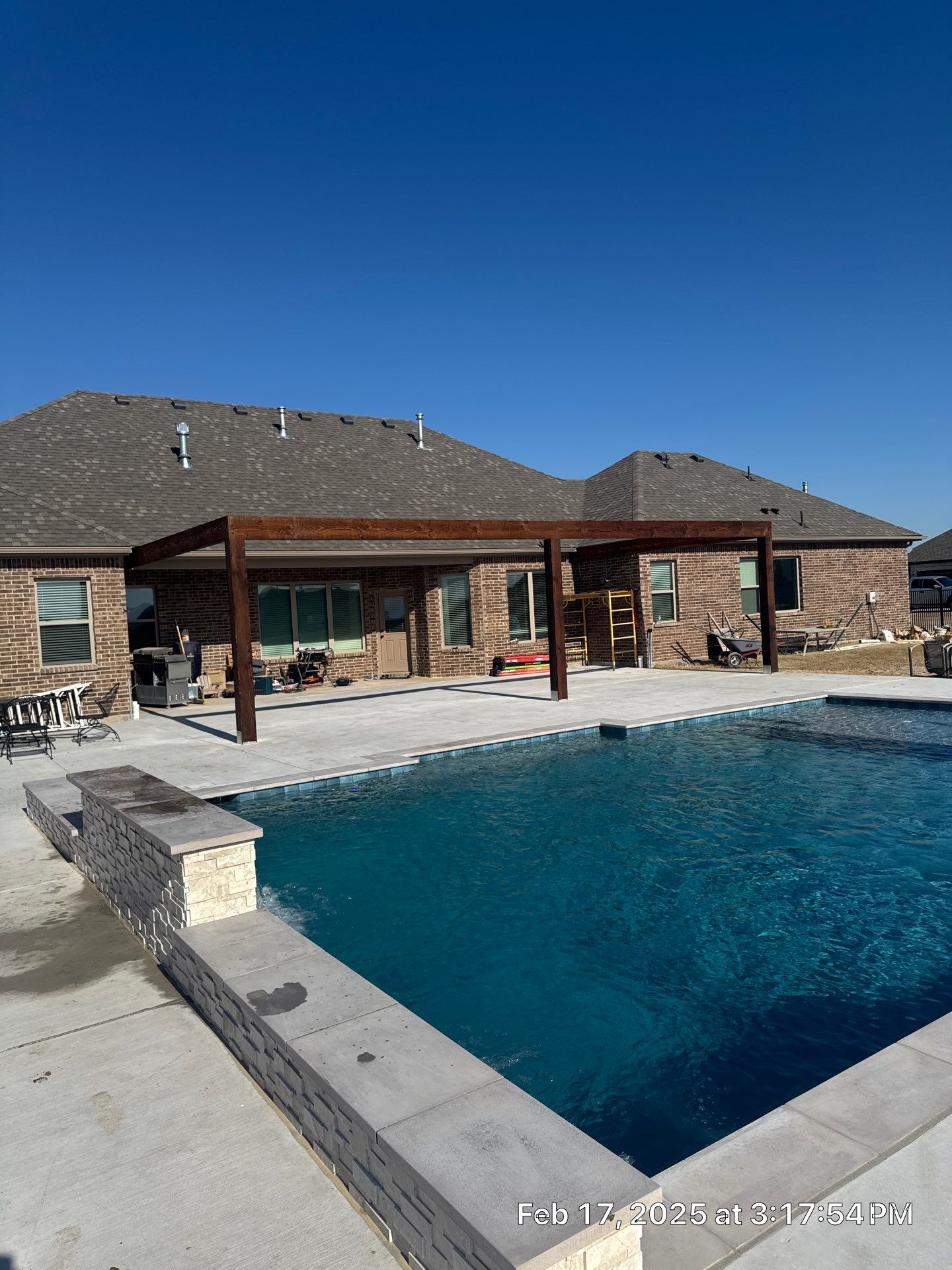 Geometric Pool with Raised Water-Feature Wall and Pergola by Pinnacle Pools and Spas - DFW