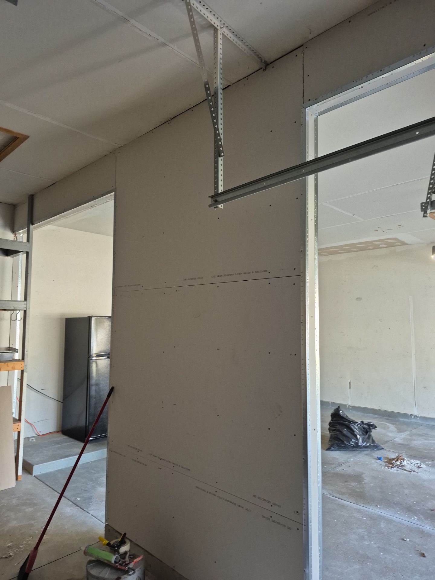 Custom Epoxy Flake Floor and Garage Wall Renovation in Ada by Gordon Painting