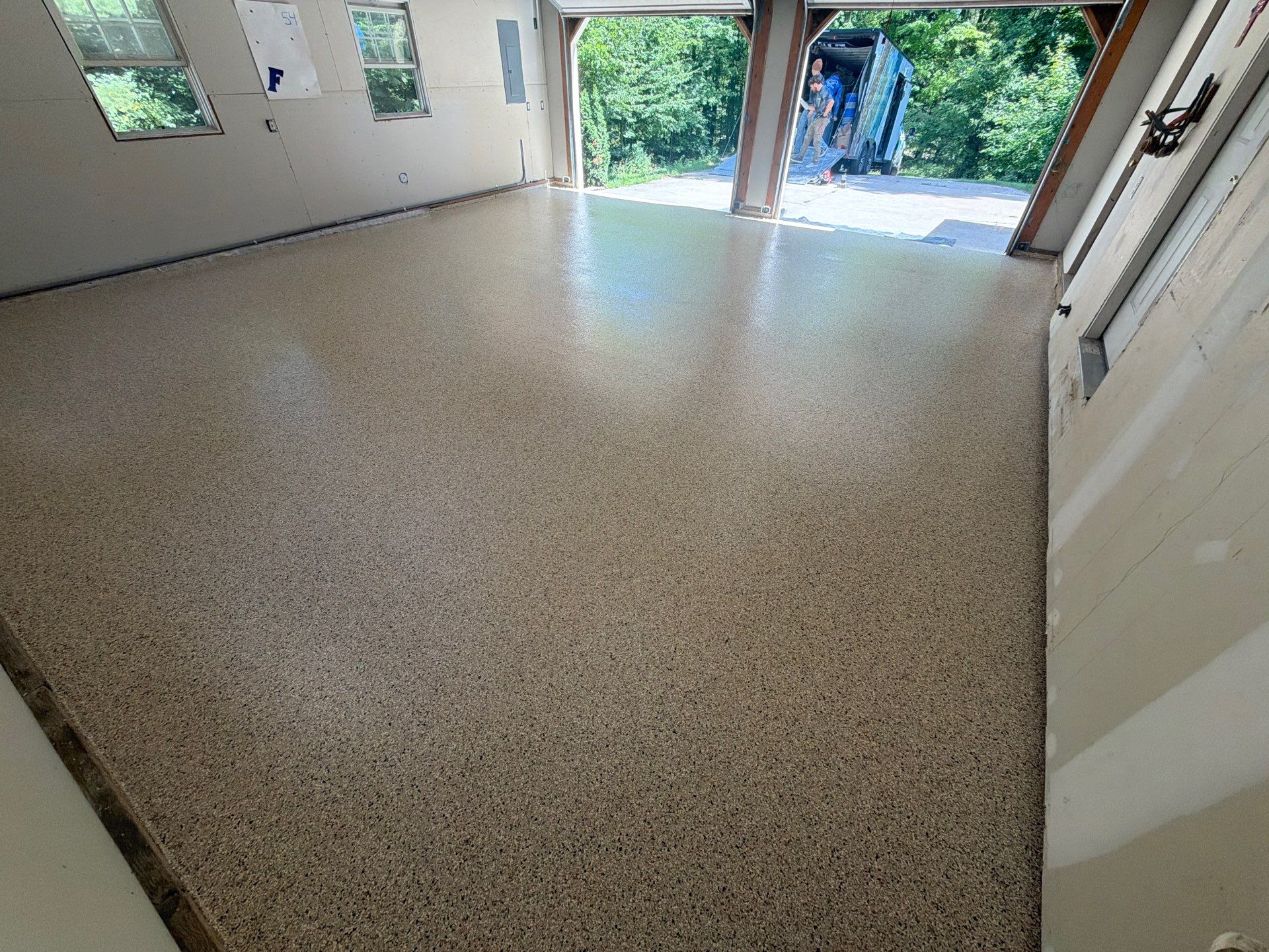 Garage Epoxy Floor Coating with Speckled Flake Finish in Fruitport by Gordon Painting