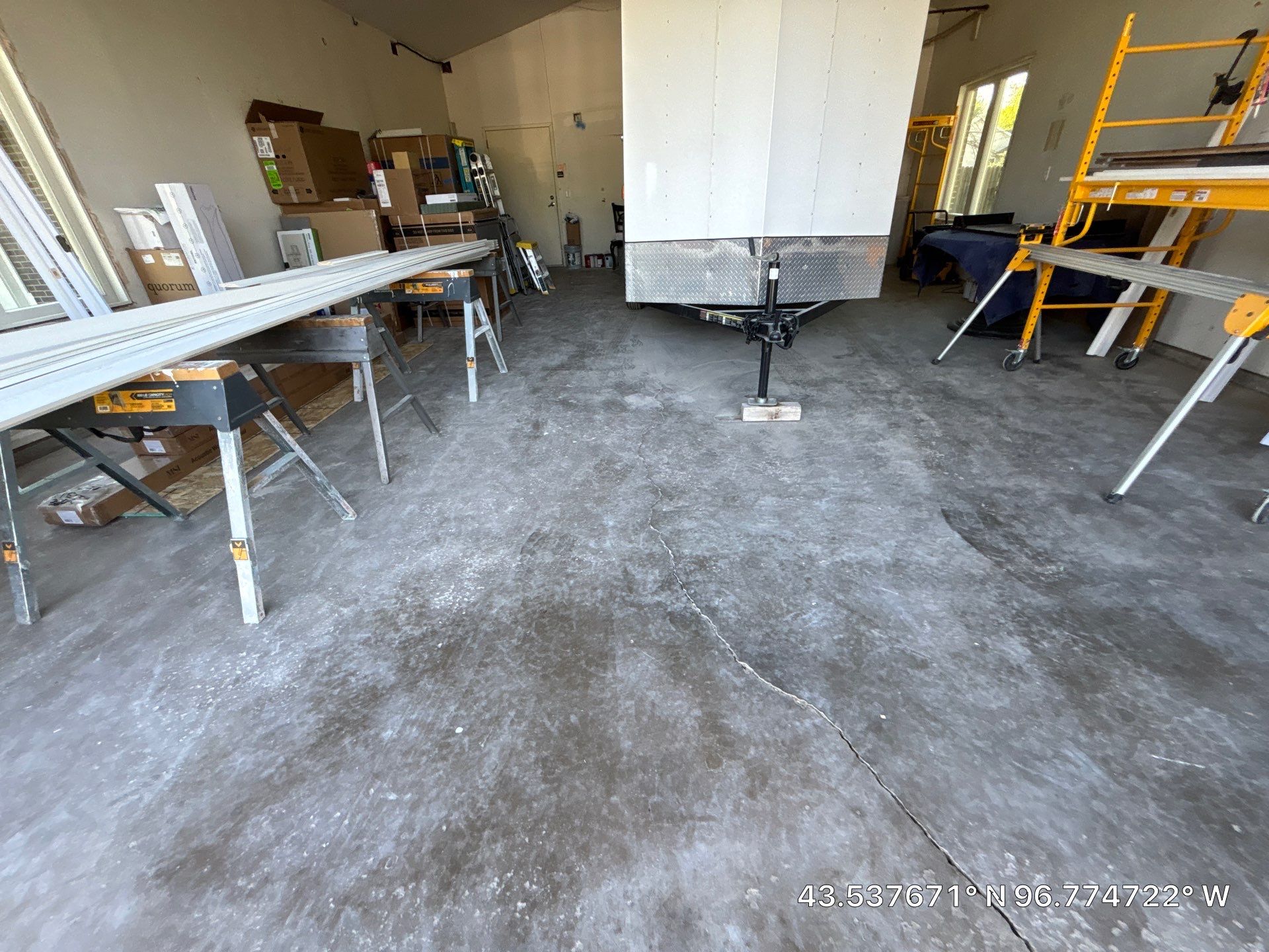 Coyote Flake Concrete Coating for Sioux Falls Garage by Select Painting, Coatings & Garage Cabinets